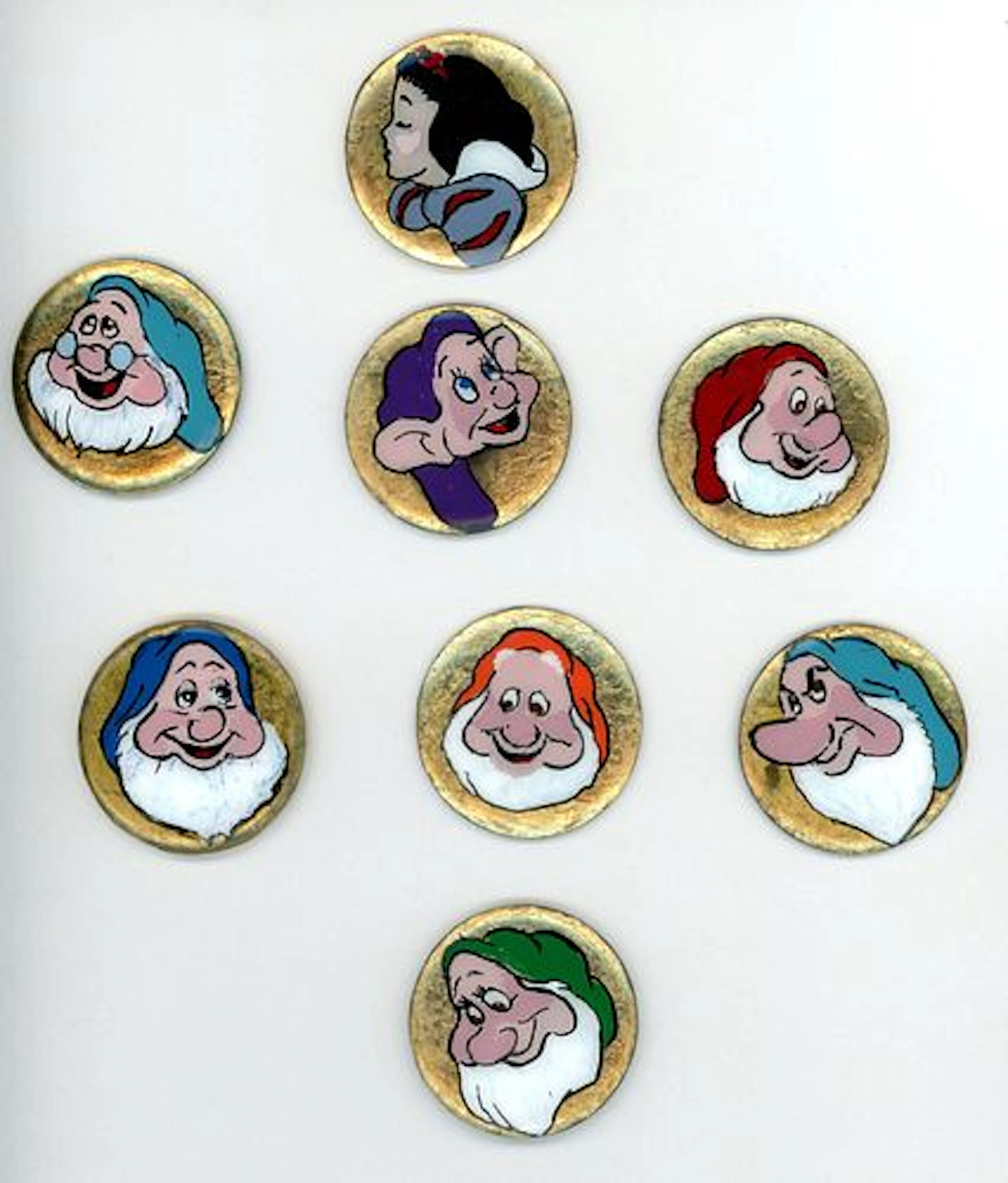 A CARD OF DIVISION THREE STUDIO ARTIST BUTTONS