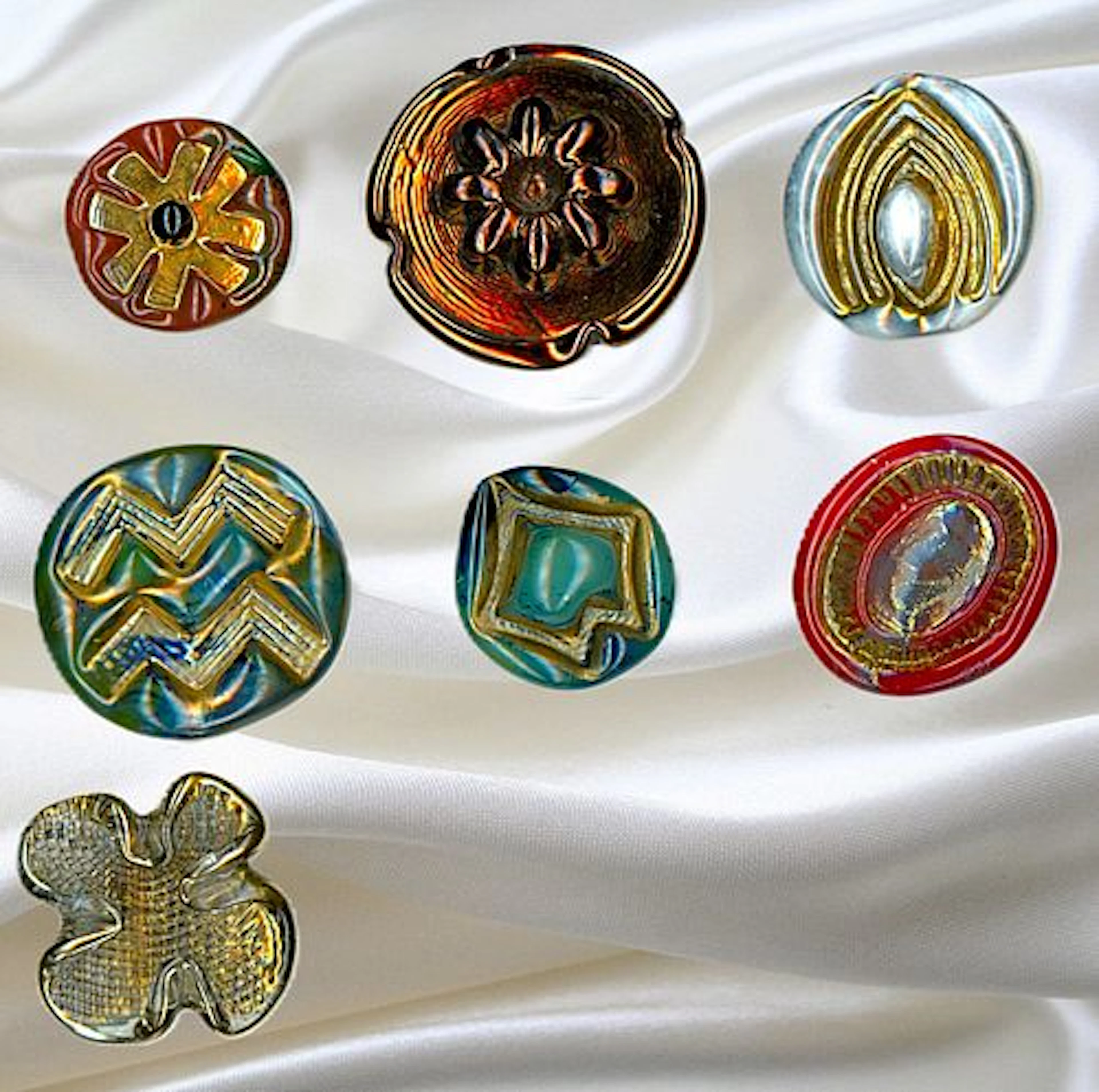 A SMALL CARD OF DIVISION THREE ENGLISH GLASS BUTTONS