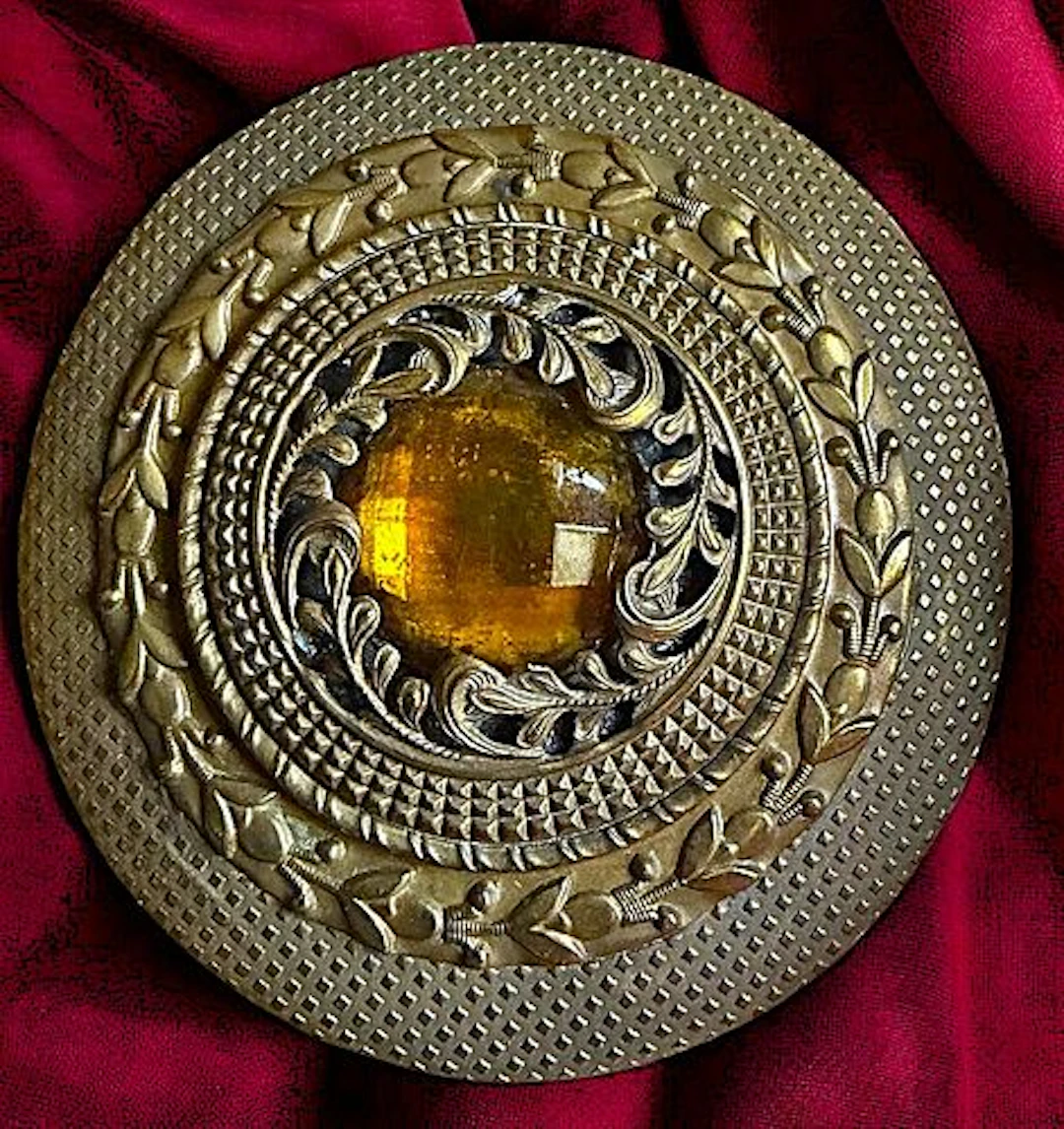 A DIVISION ONE JEWELED GAY 90 BUTTON