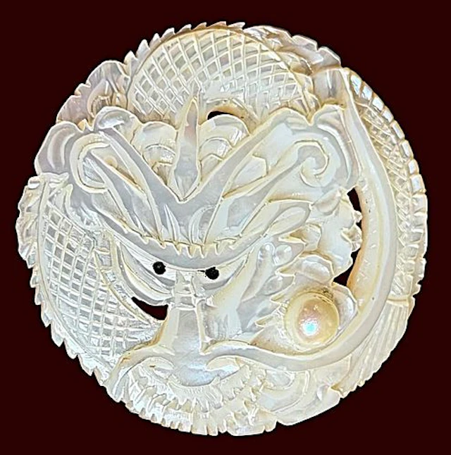 A SCARCE DIVISION ONE CARVED PIERCED PEARL BUTTON