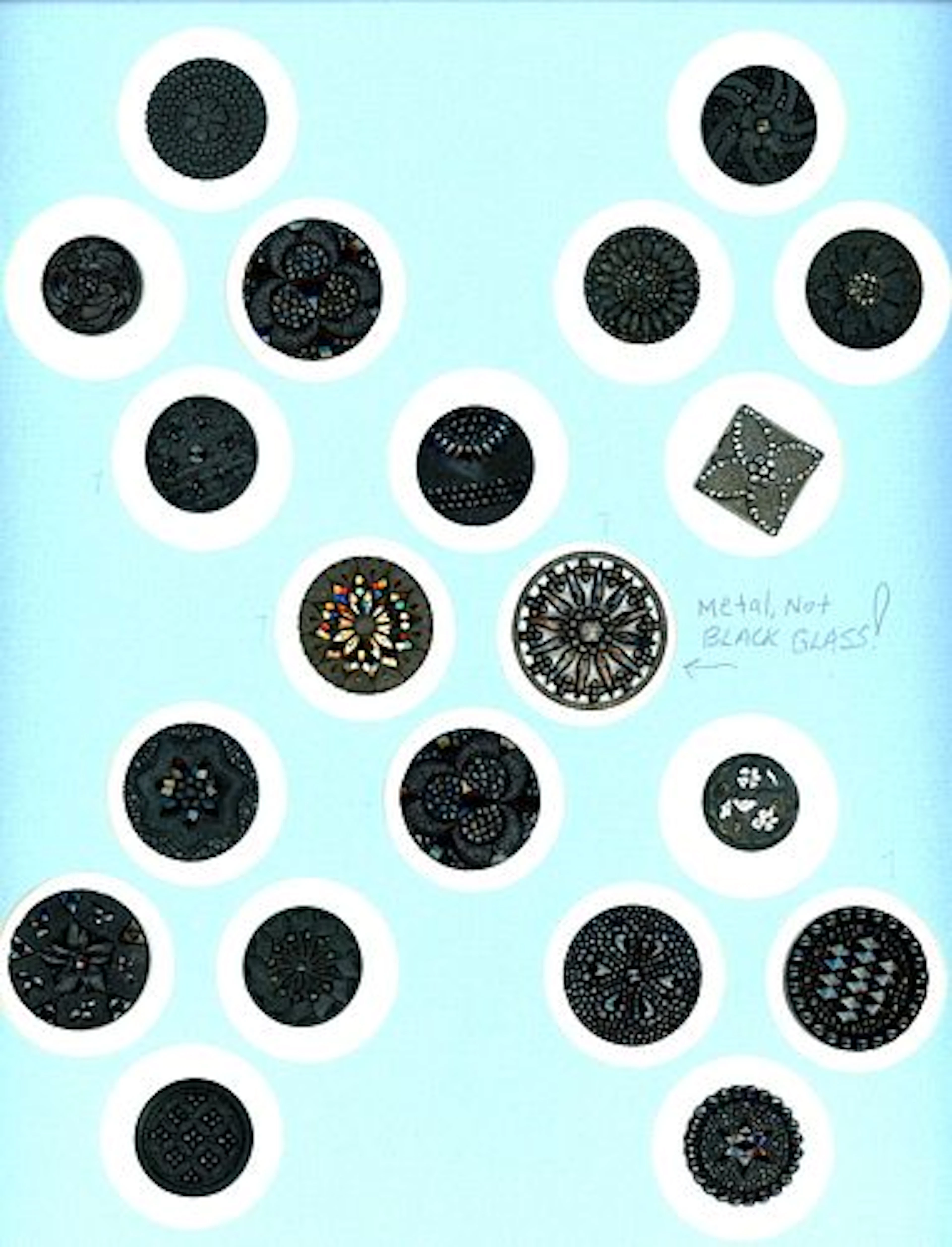 A CARD OF DIVISION ONE BLACK GLASS BUTTONS