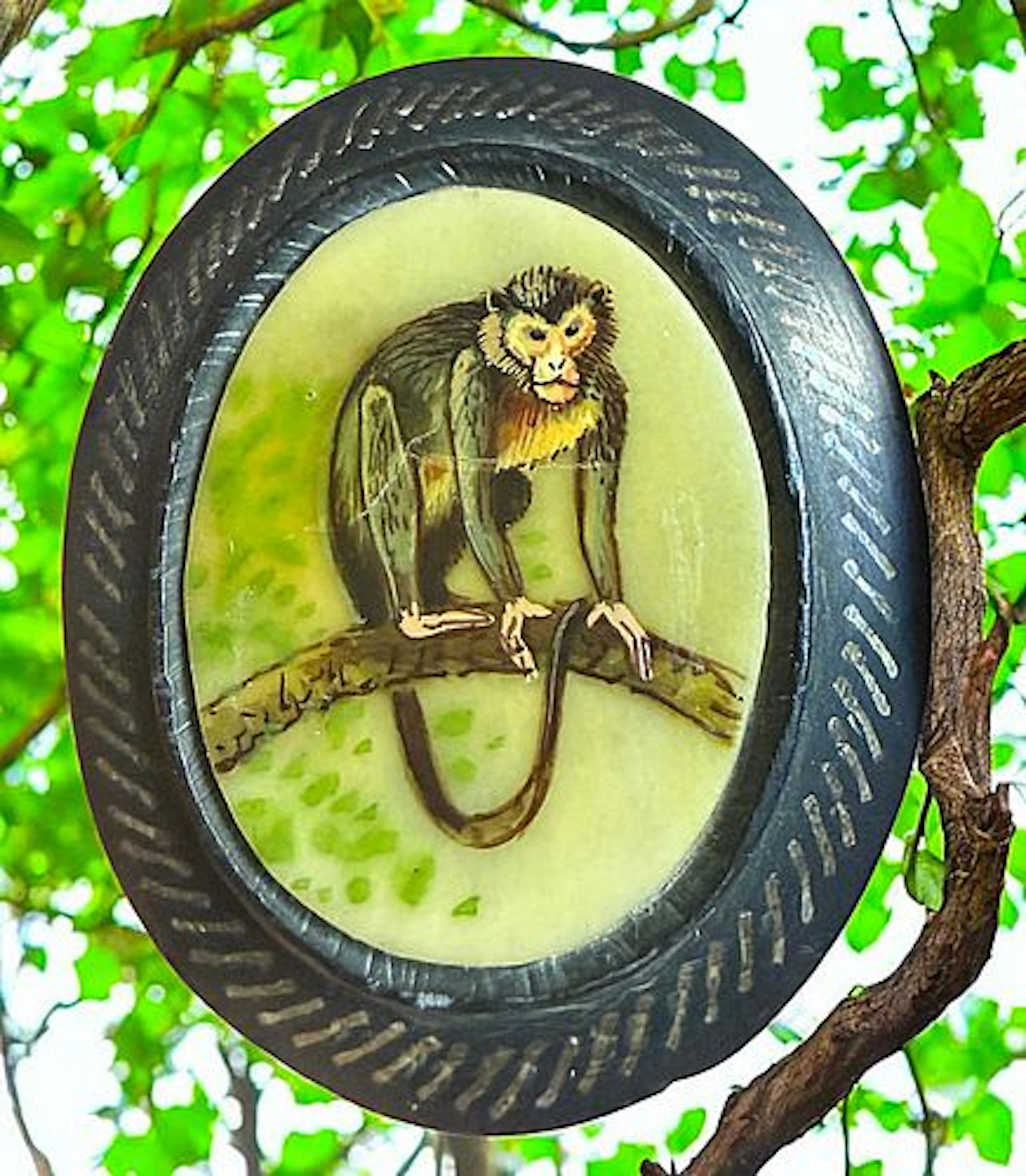 A DIVISION THREE HAND PAINTED MONKEY BUTTON