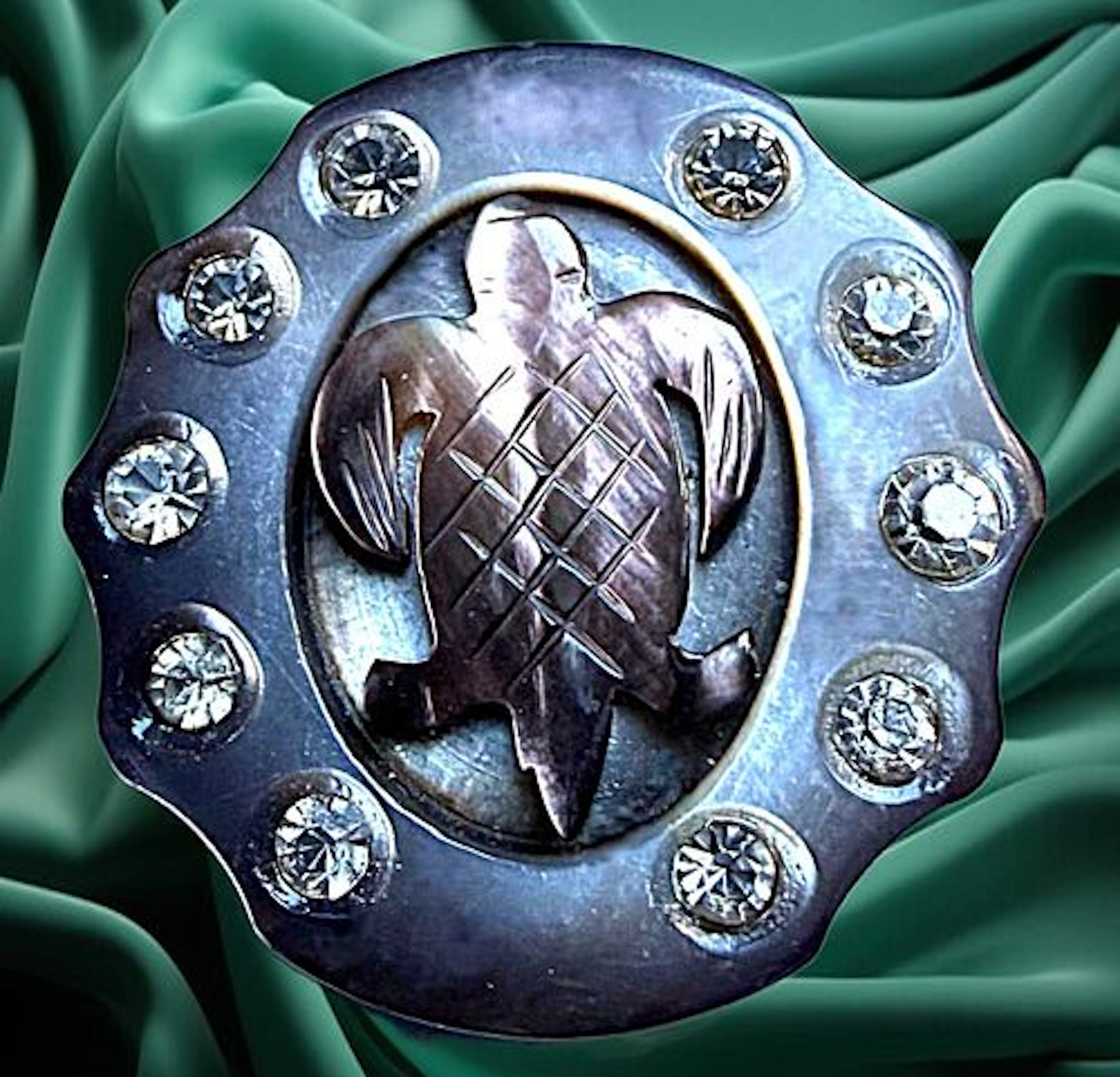 A DIVISION ONE CARVED PEARL AND PASTE ANIMAL BUTTON