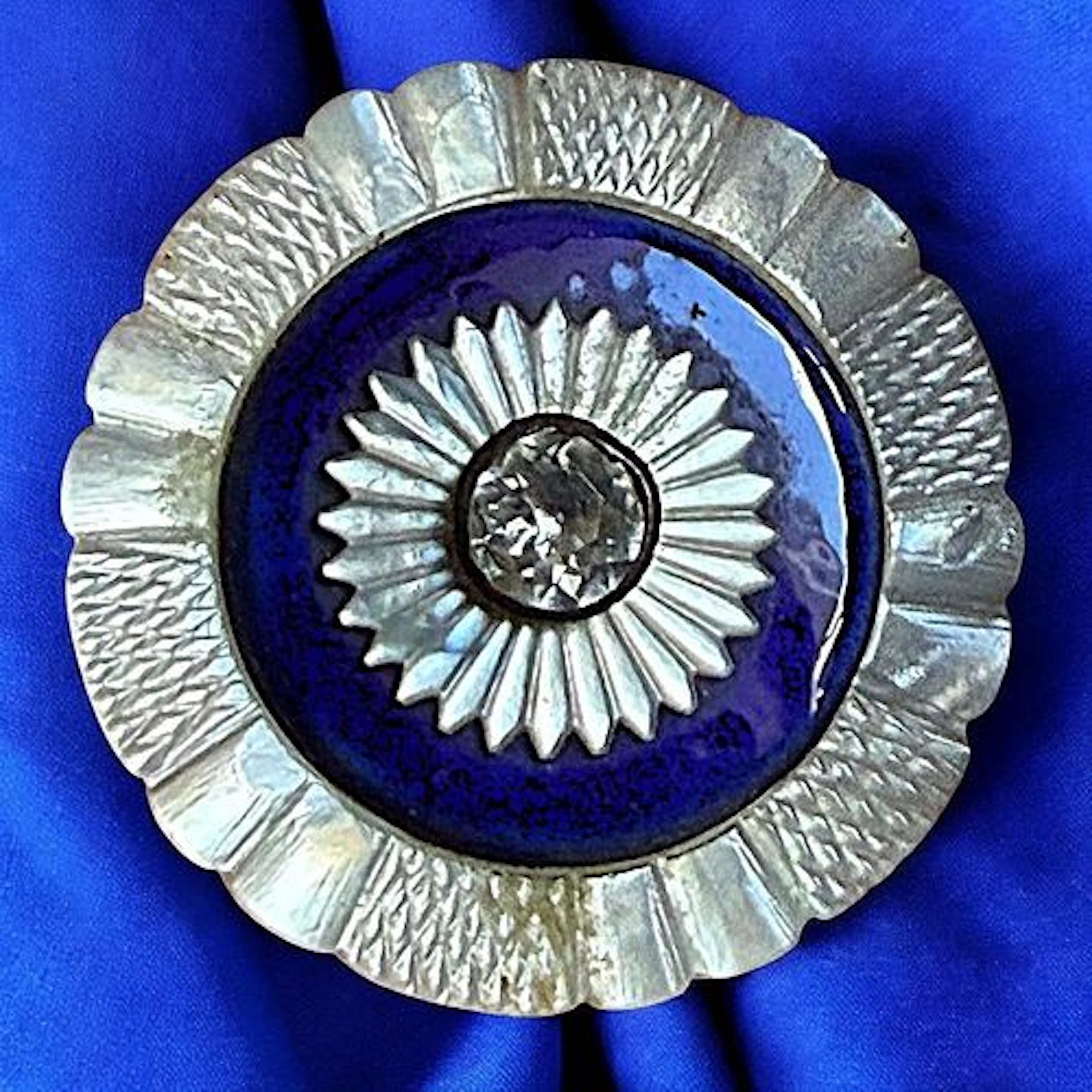 A DIVISION ONE PEARL-ENAMEL & PASTE BUTTON