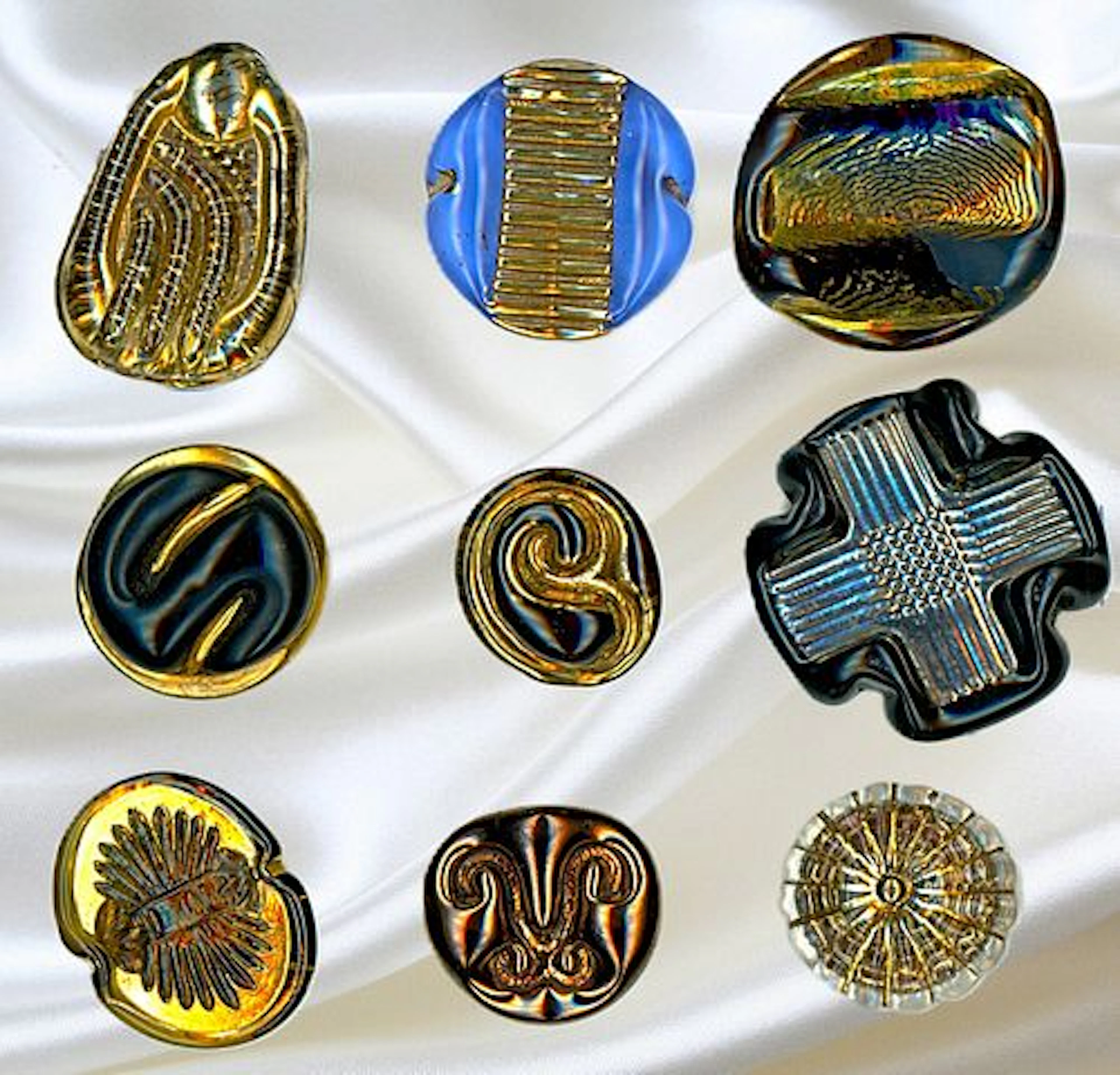 A SMALL CARD OF DIVISION THREE ENGLISH GLASS BUTTONS