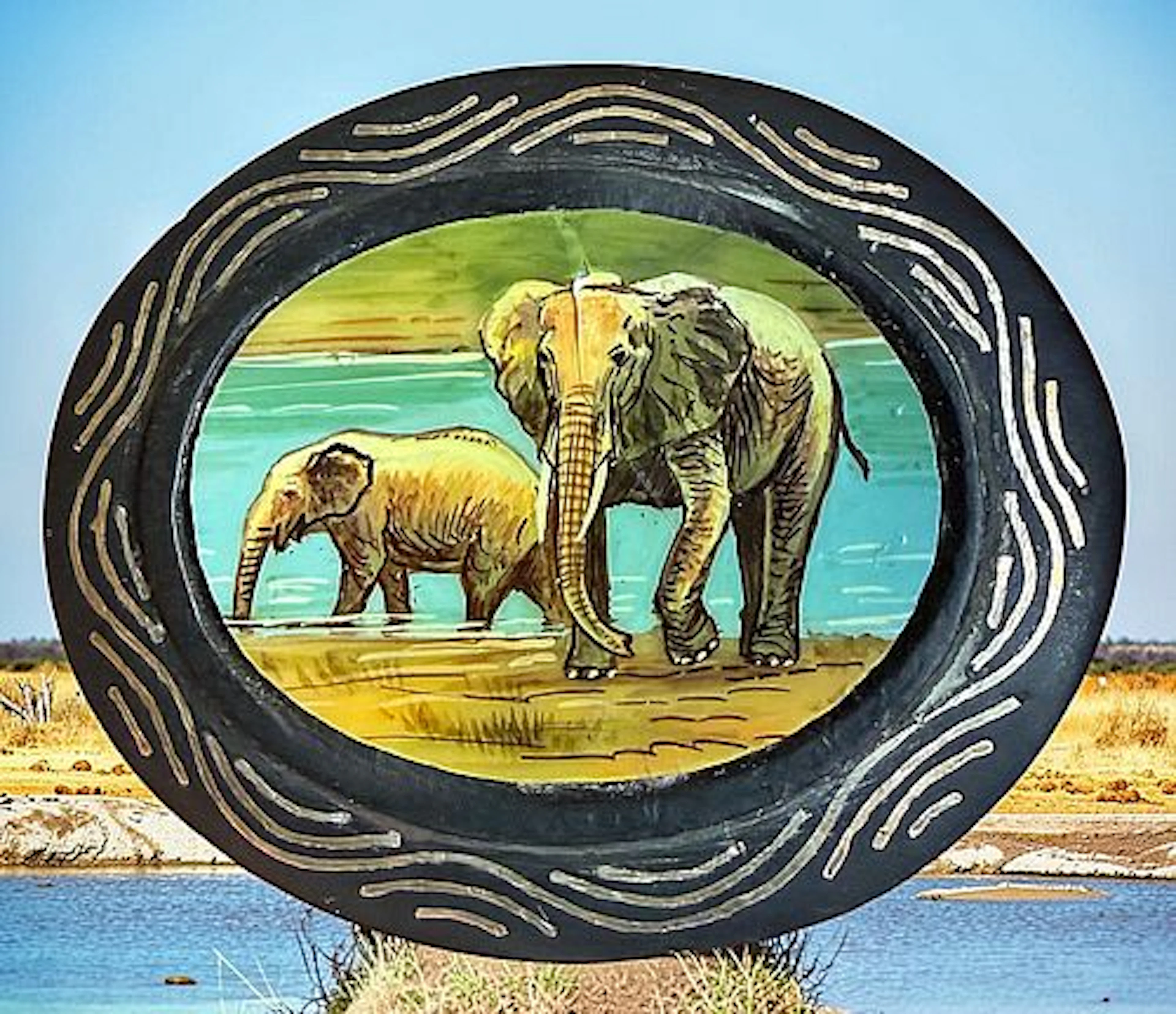 A DIVISION THREE HAND PAINTED ELEPHANT BUTTON