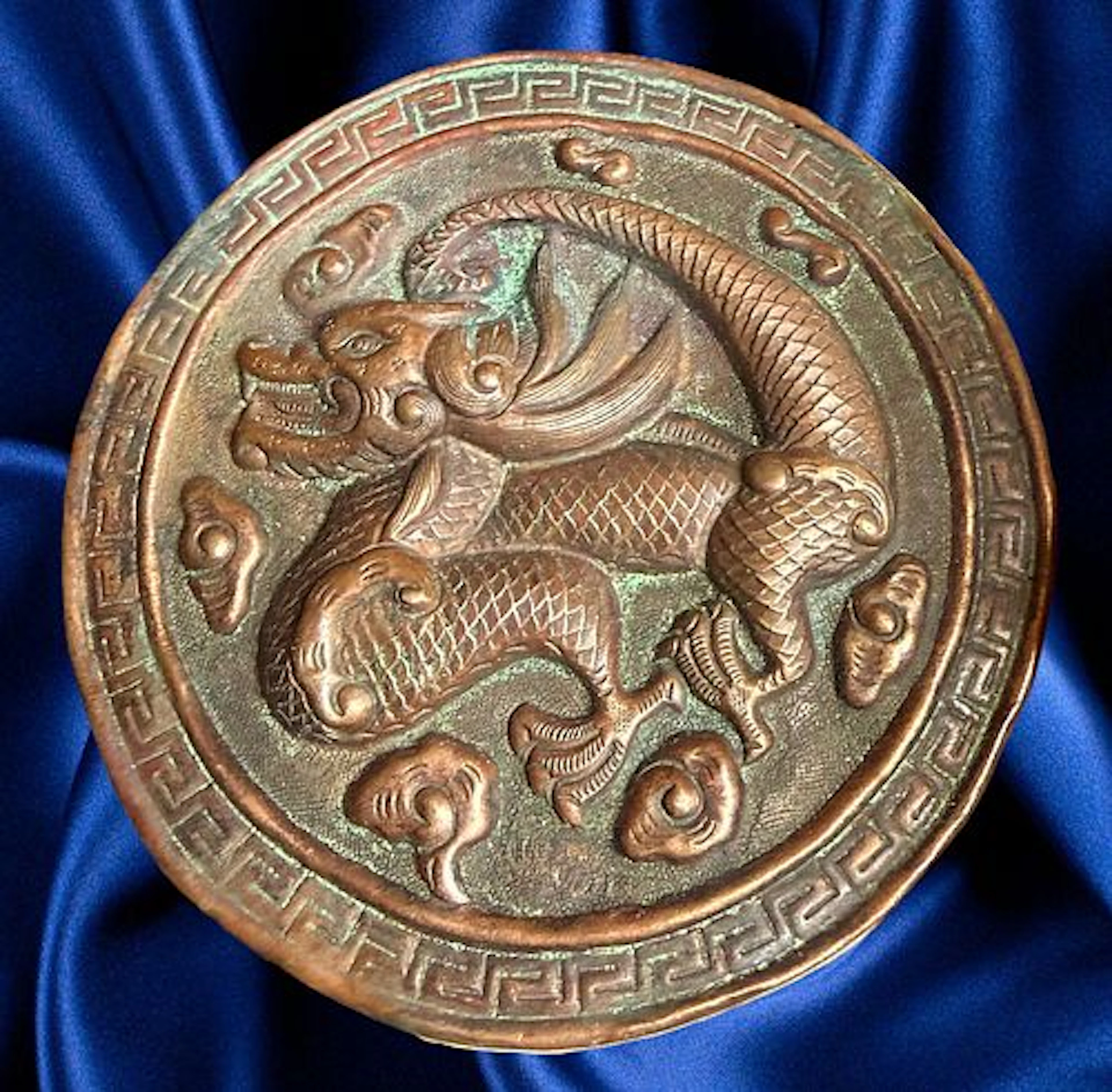 A DIVISION ONE REPOUSSE COPPER BUTTON