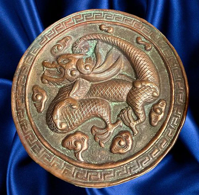 A DIVISION ONE REPOUSSE COPPER BUTTON
