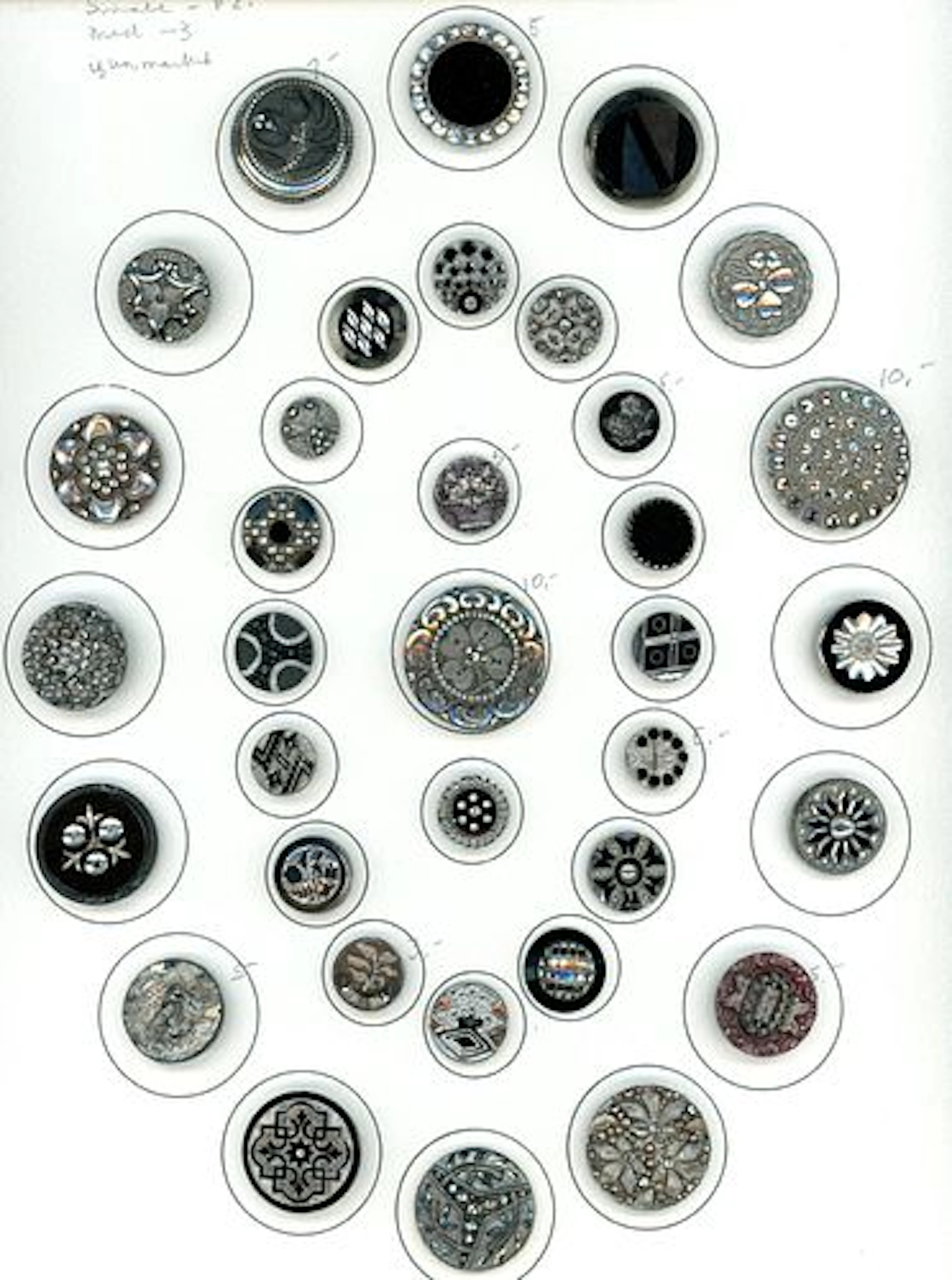 A CARD OF DIVISION ONE BLACK GLASS BUTTONS