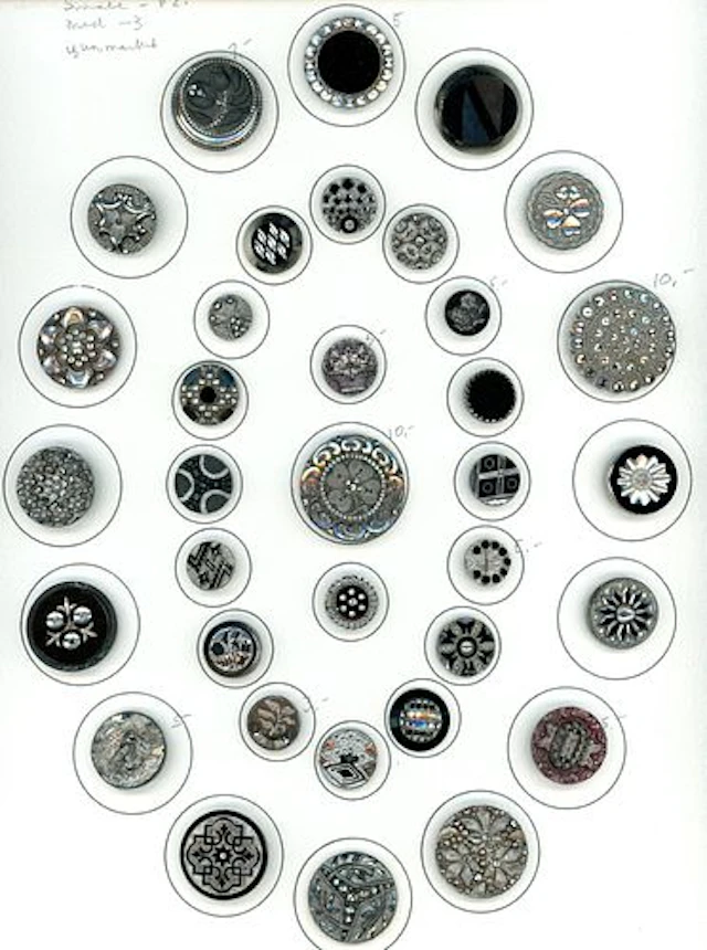 A CARD OF DIVISION ONE BLACK GLASS BUTTONS