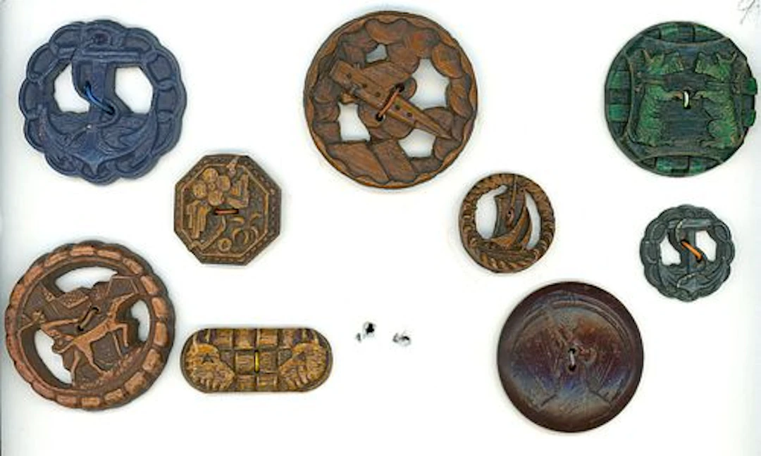 A PARTIAL CARD OF DIVISION THREE BURWOOD BUTTONS