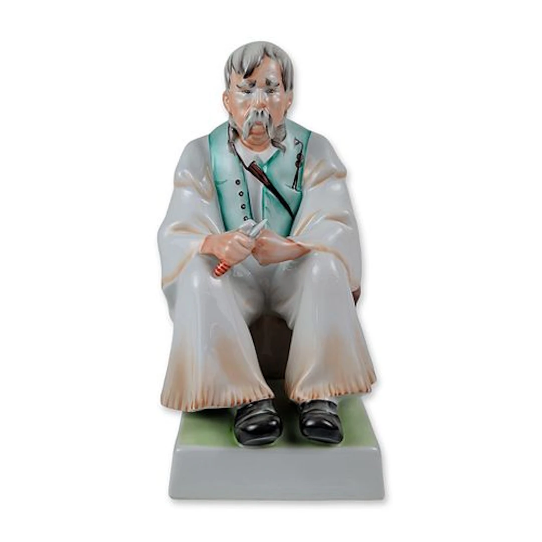 Zsolnay Pecs Hungarian Porcelain Seated Carver Figurine