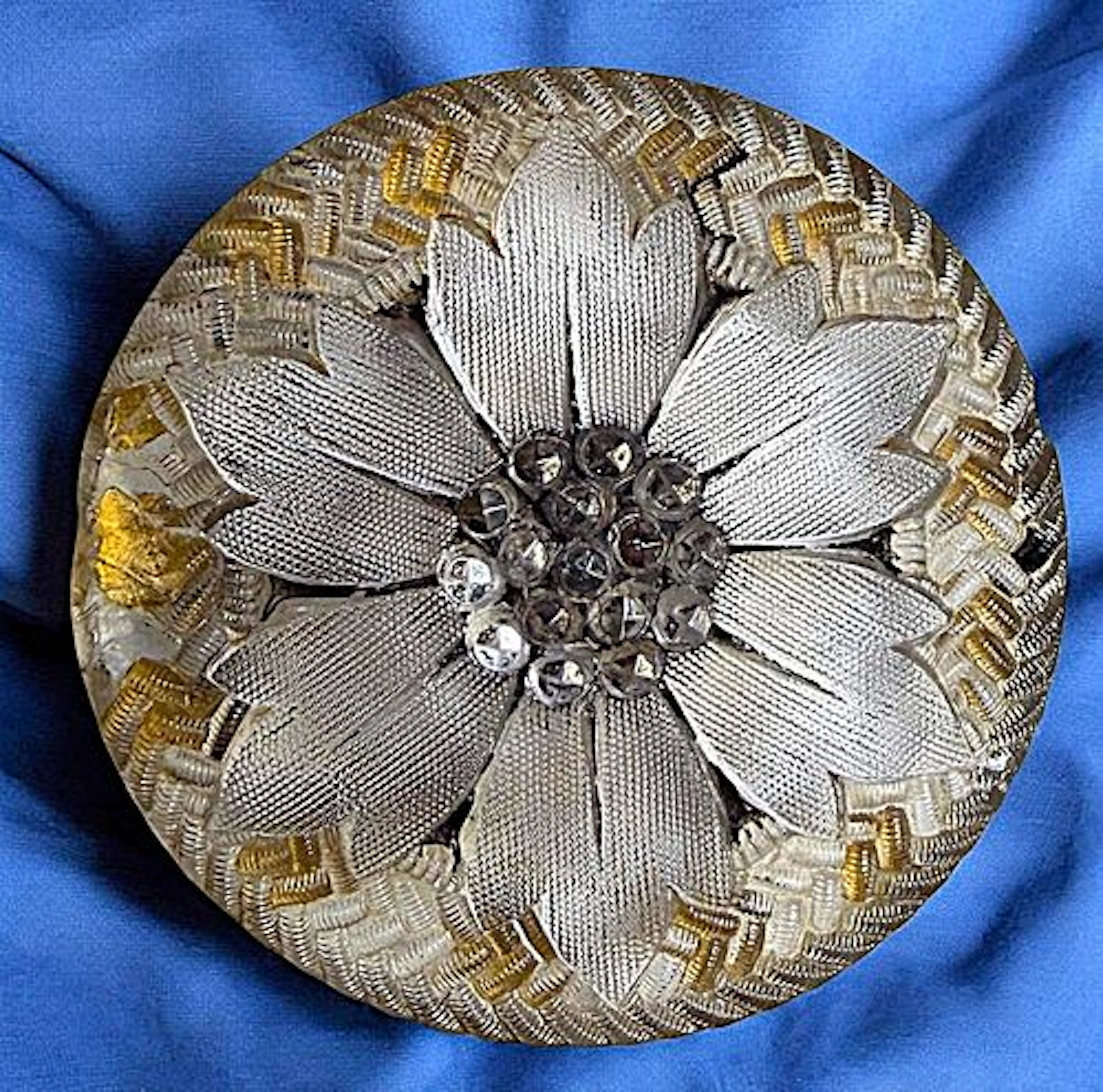 A DIVISION ONE LACY GLASS BUTTON
