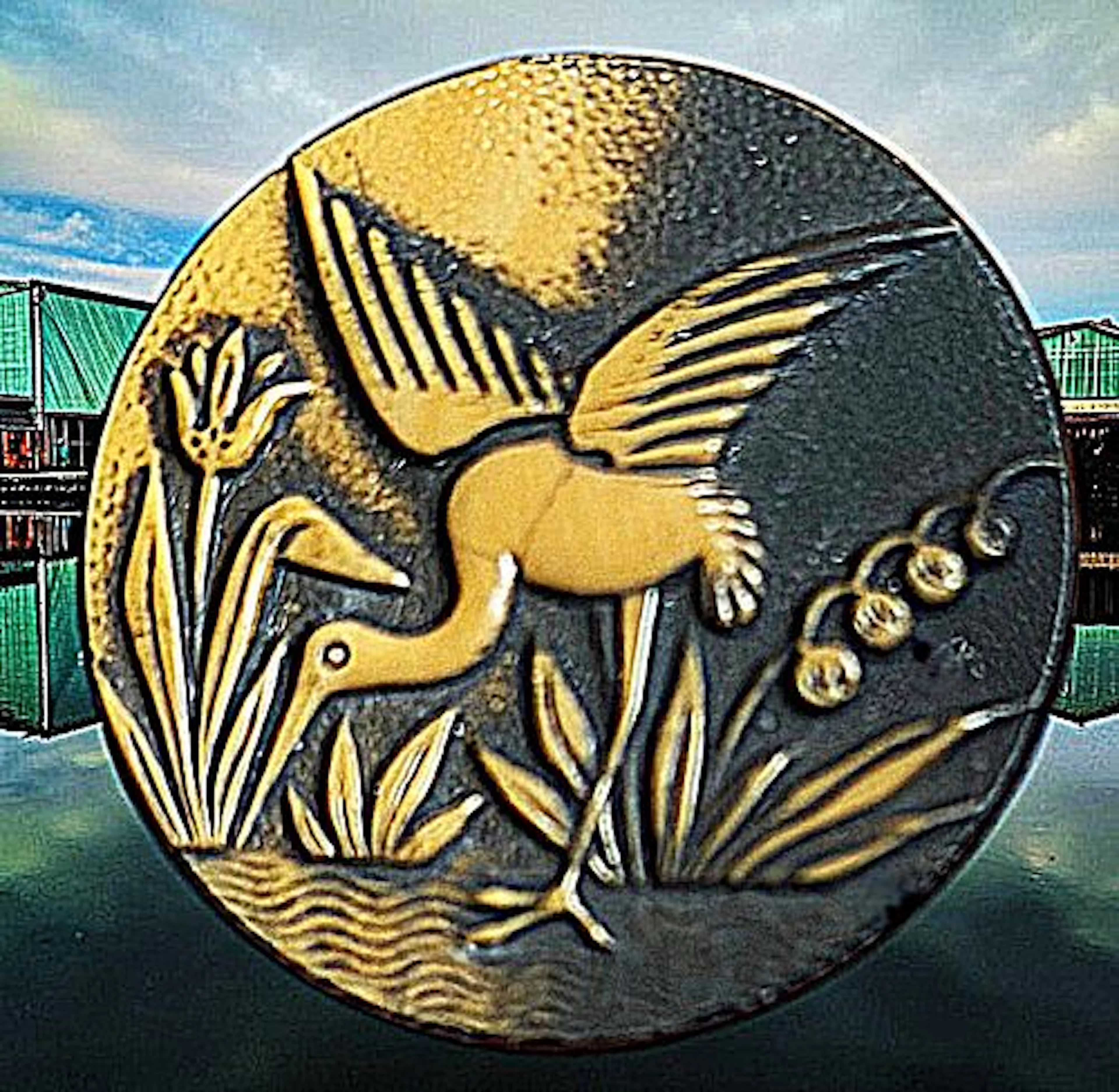 A DIVISION THREE SCARCE CARAMEL GLASS PICTORIAL BUTTON