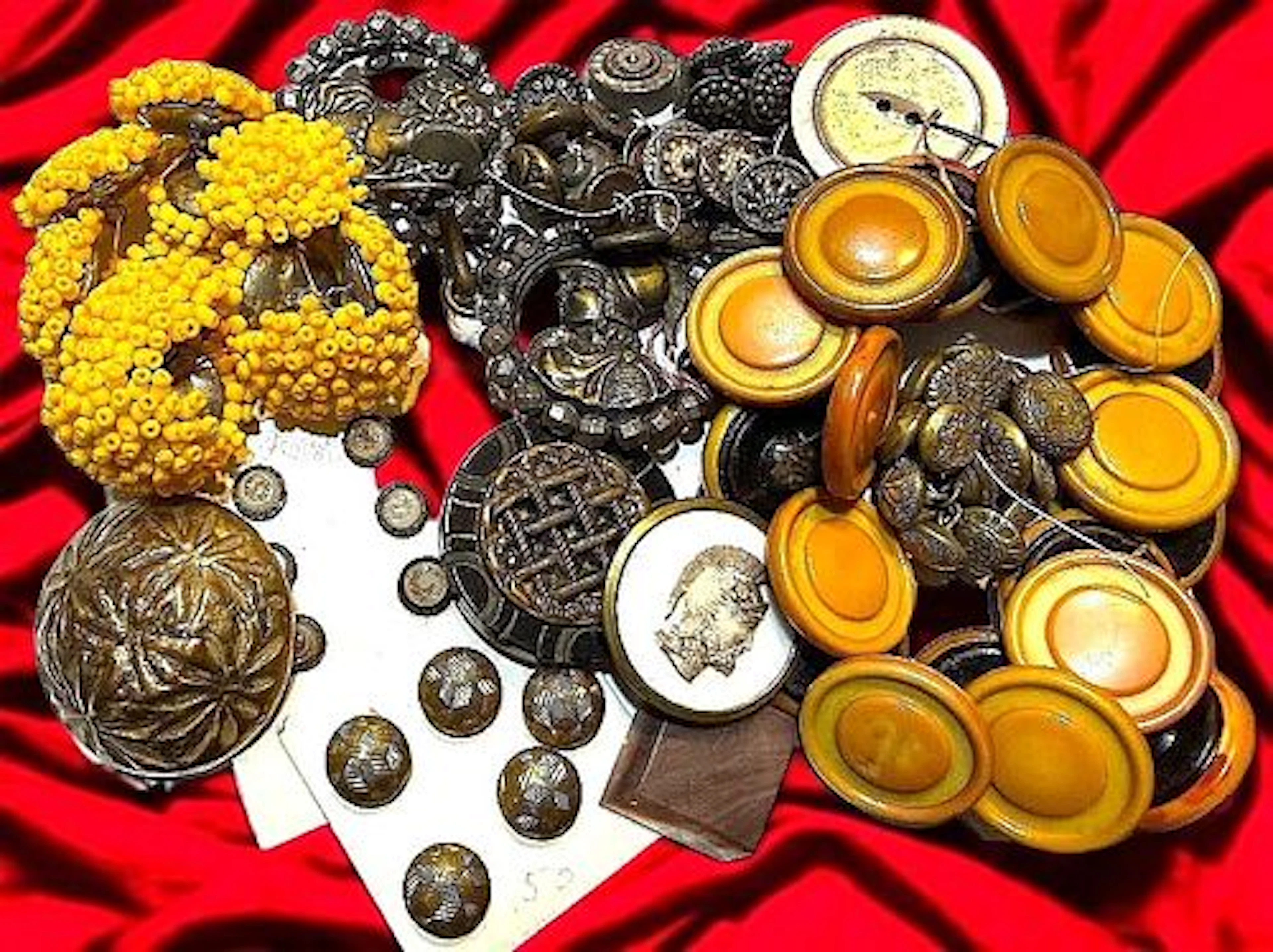 A BAG LOT OF ASSORTED DIVISION MATERIAL BUTTONS