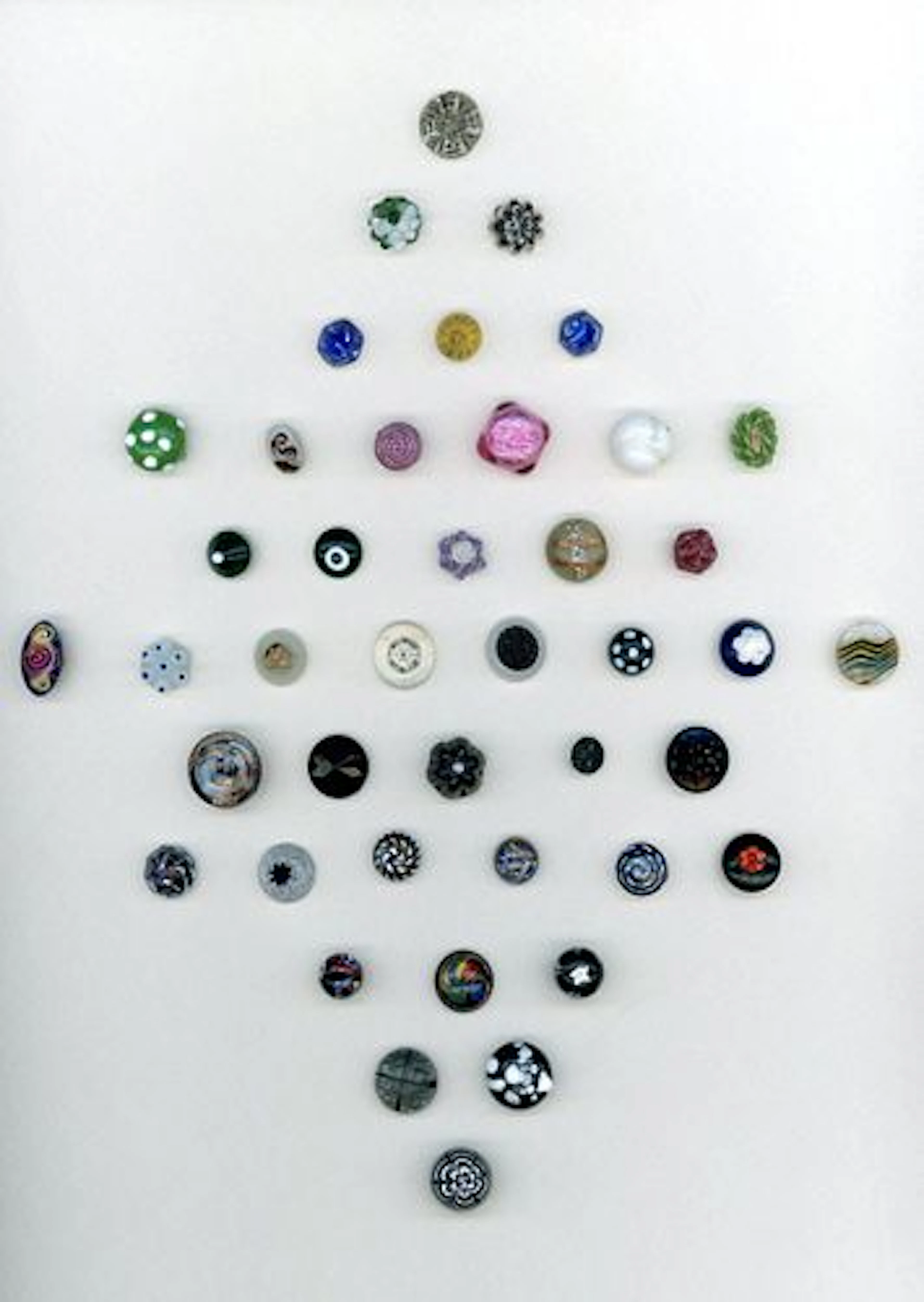 A CARD OF DIVISION ONE CHARMSTRING GLASS BUTTONS