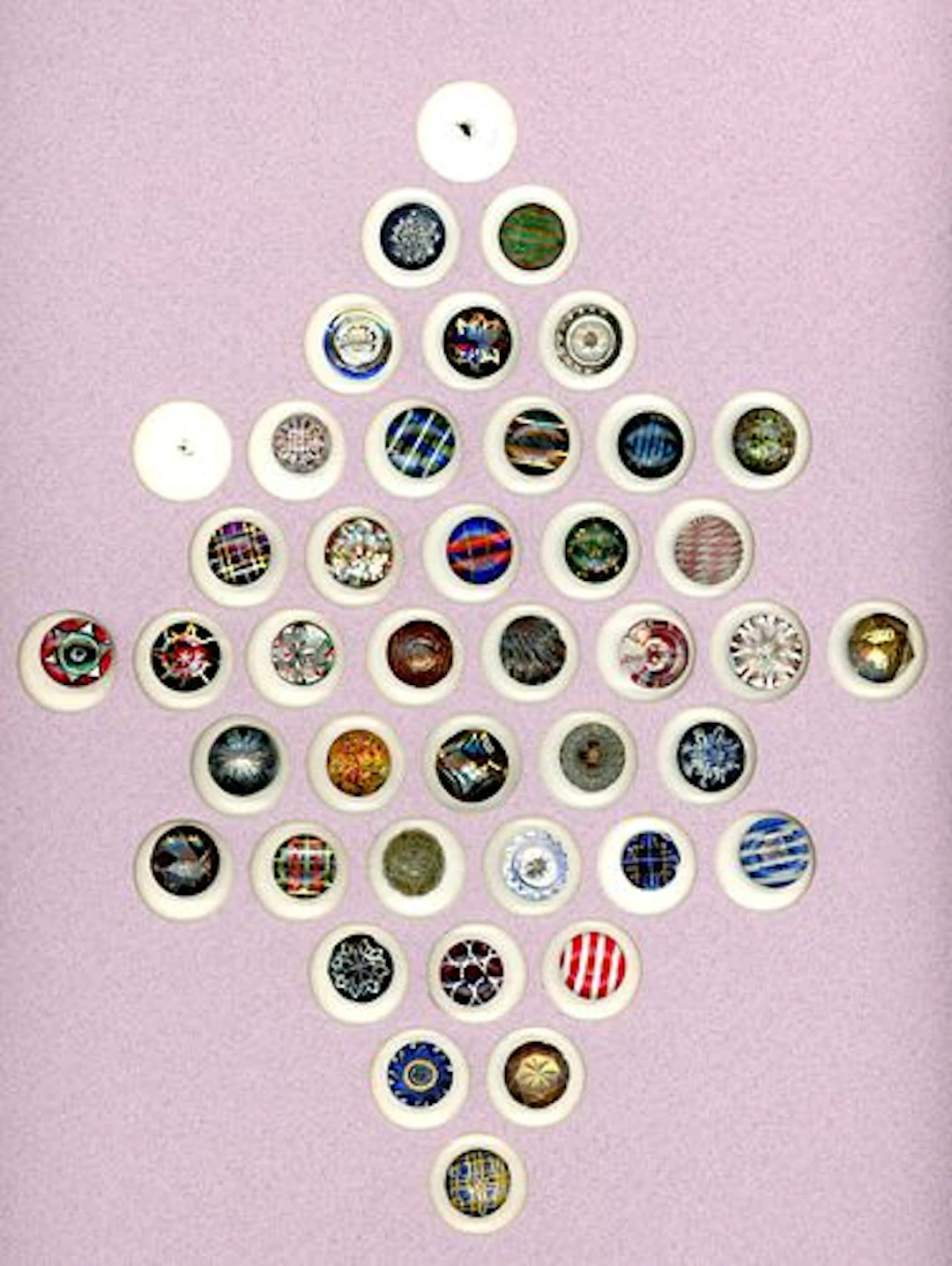 A CARD OF DIVISION ONE COLORFUL GLASS BUTTONS