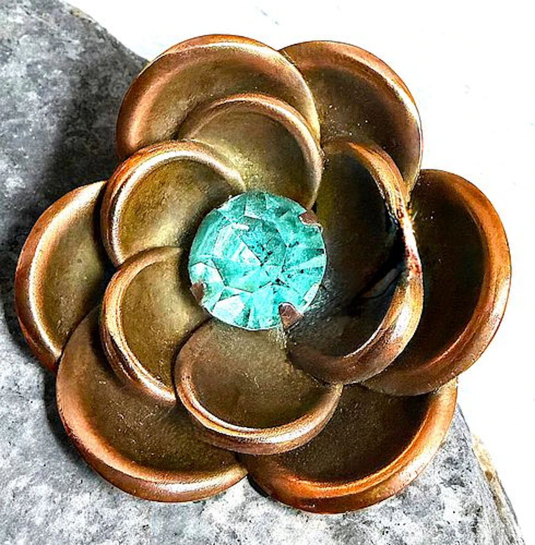 A DIVISION ONE COPPER REALISTIC JEWELED BUTTON
