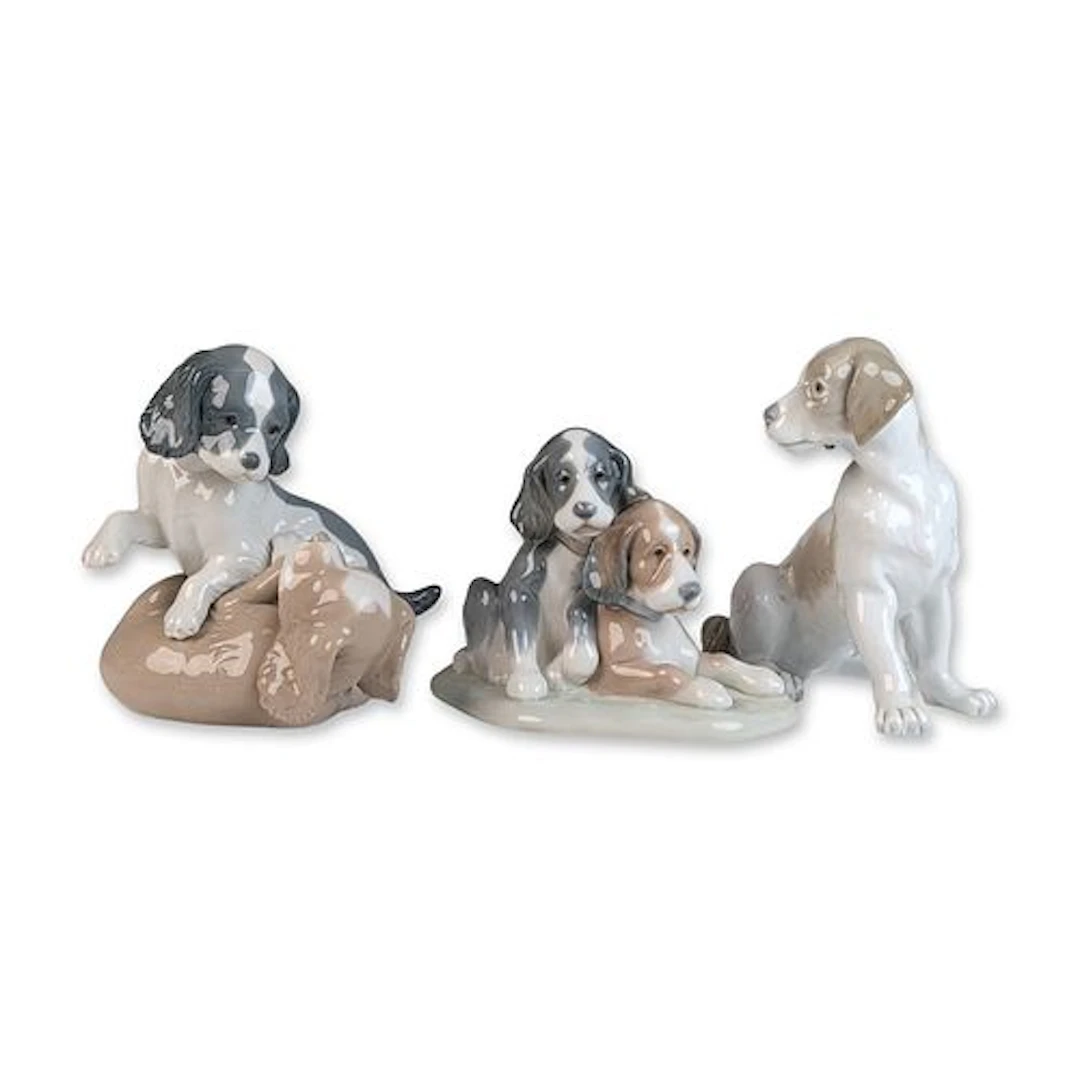 Three Lladro and Nao by Lladro Porcelain Puppy Figurines