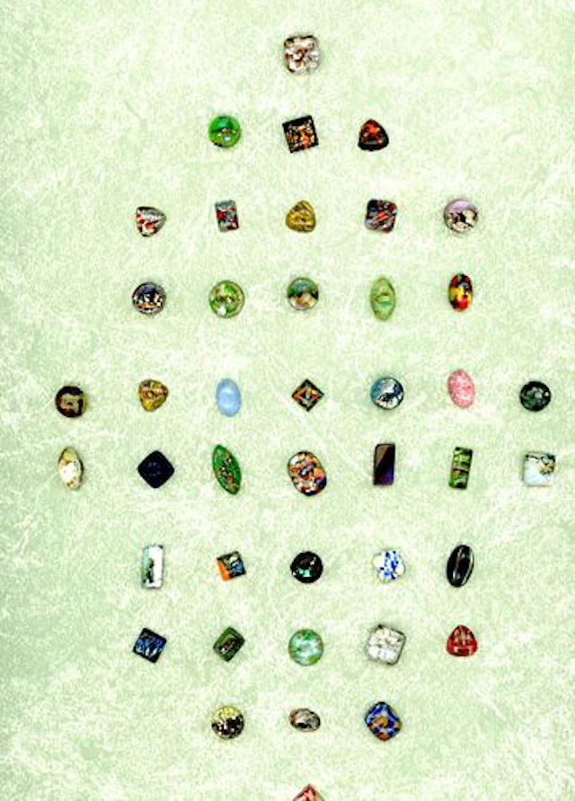 A CARD OF DIVISION ONE POPPER GLASS BUTTONS