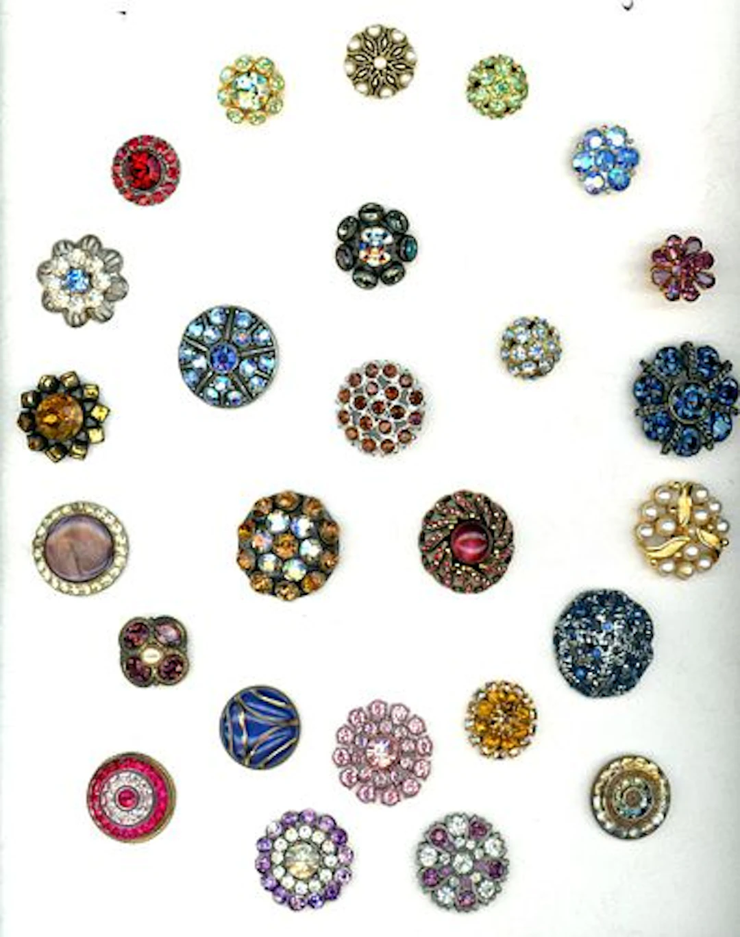 A CARD OF DIVISION ONE AND THREE JEWELED BUTTONS