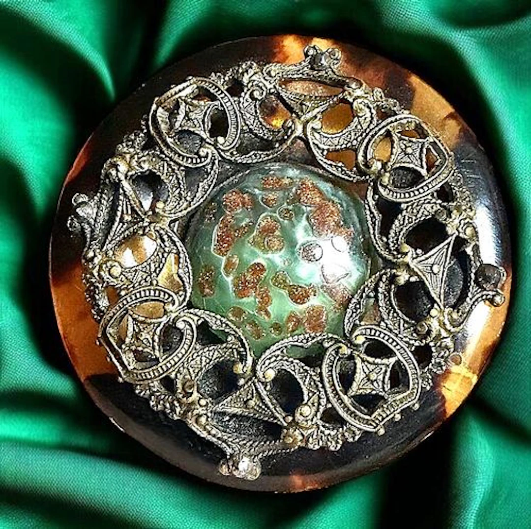 A DIVISION ONE SHELL AND GLASS BUTTON