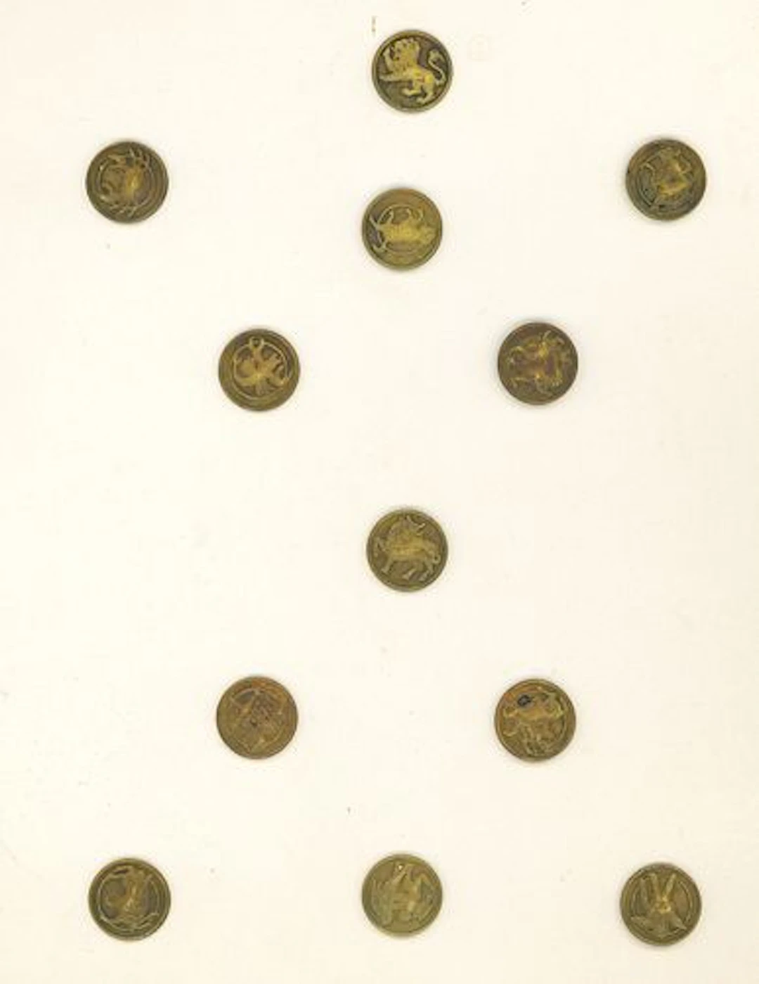 A SET OF DIVISION ONE ZODIAC BUTTONS
