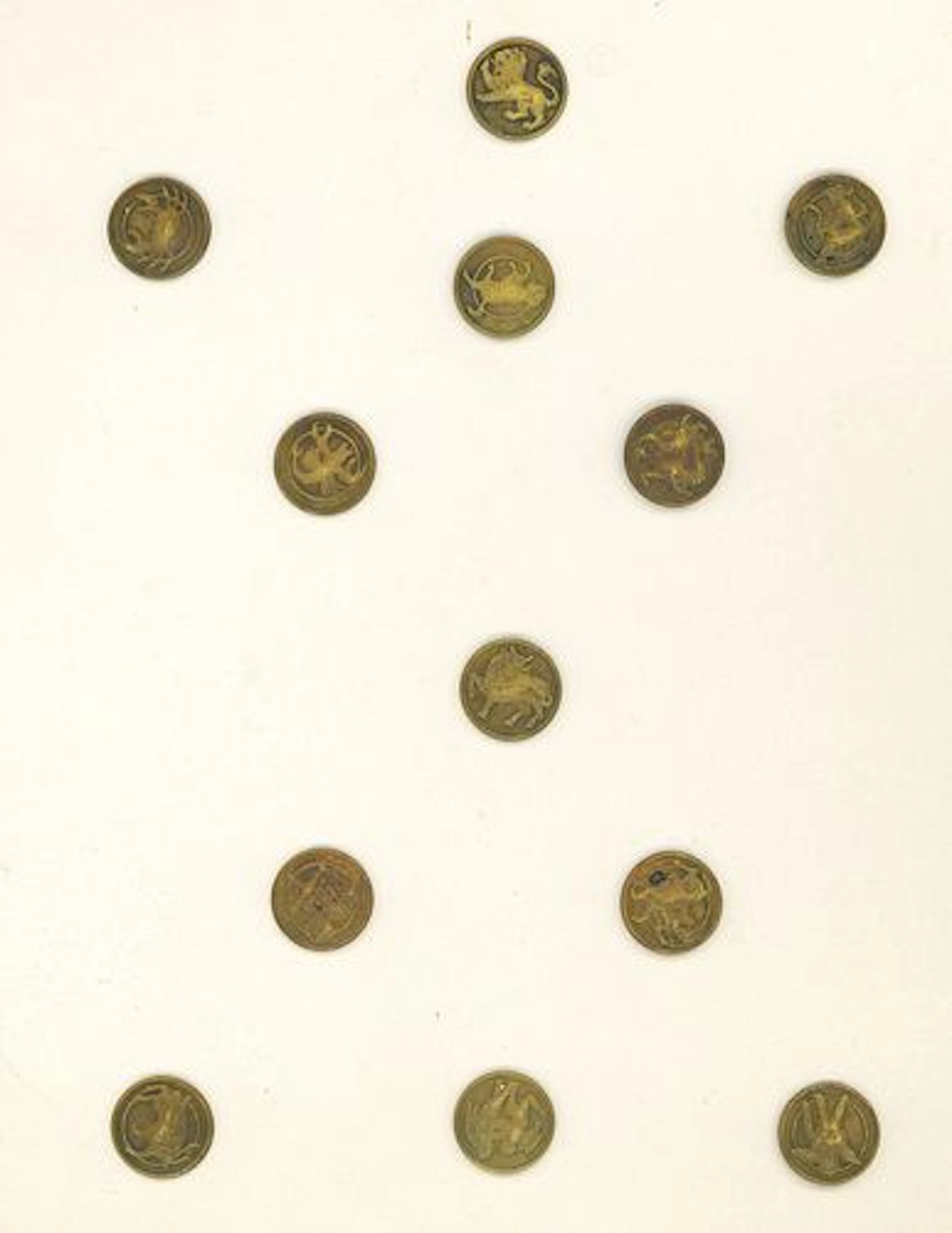 A SET OF DIVISION ONE ZODIAC BUTTONS