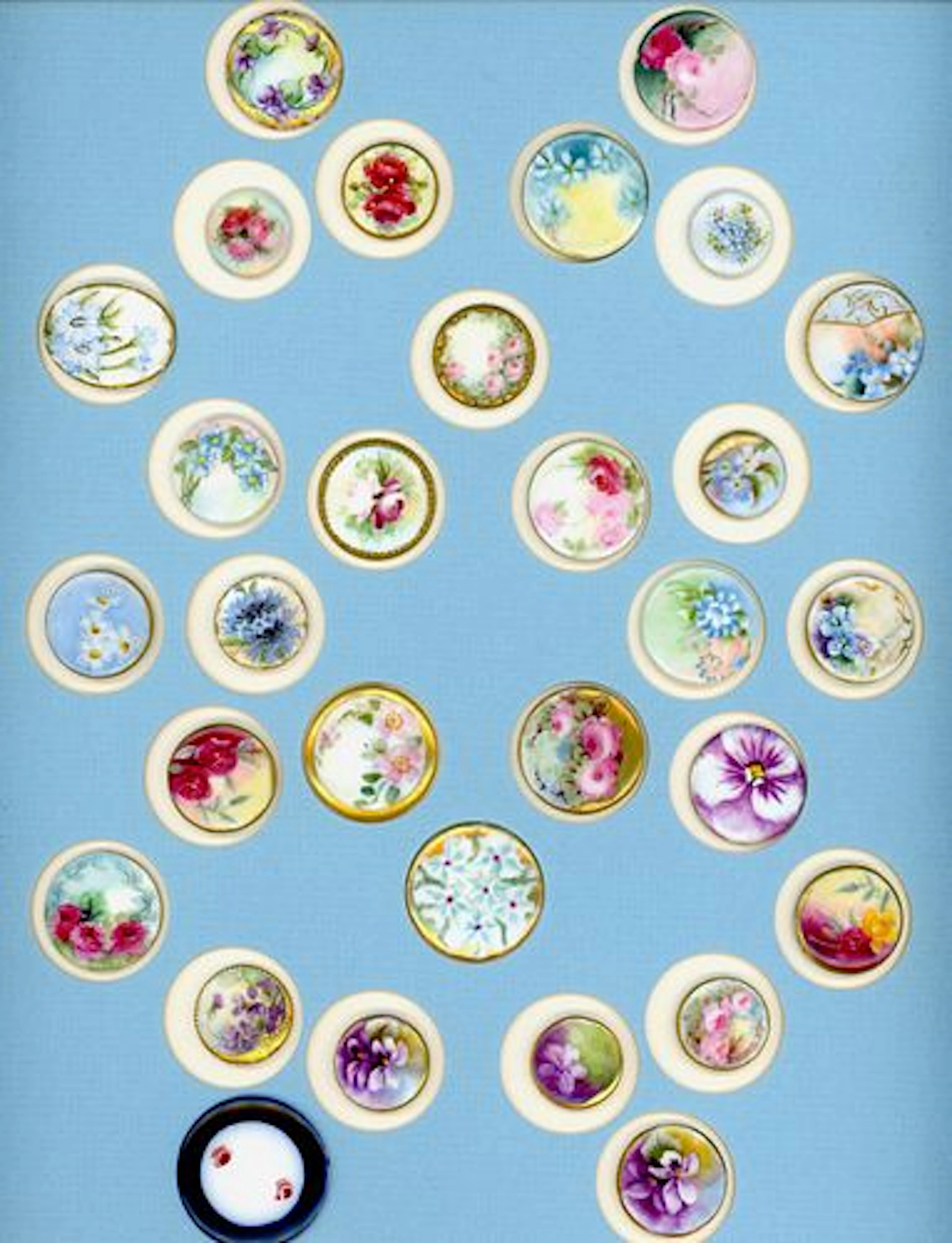 A CARD OF DIVISION ONE HAND PAINTED CERAMIC BUTTONS