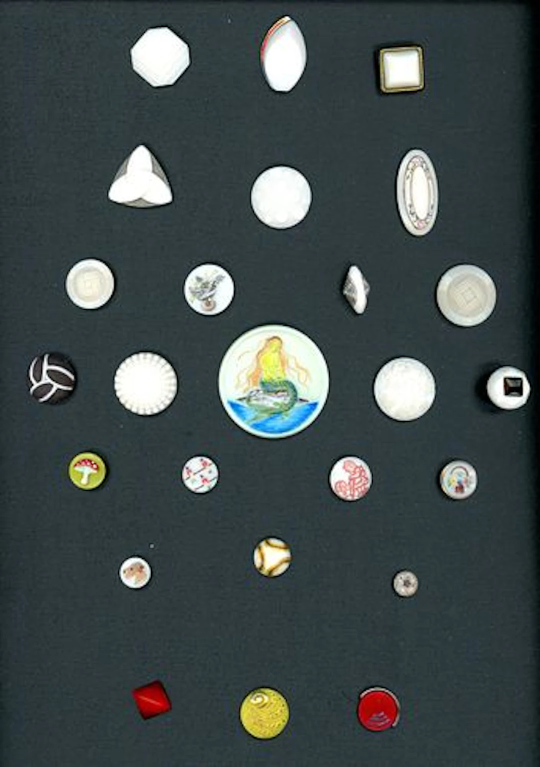 A SPECIAL CARD OF DIVISION 3 MOSTLY WHITE GLASS BUTTONS