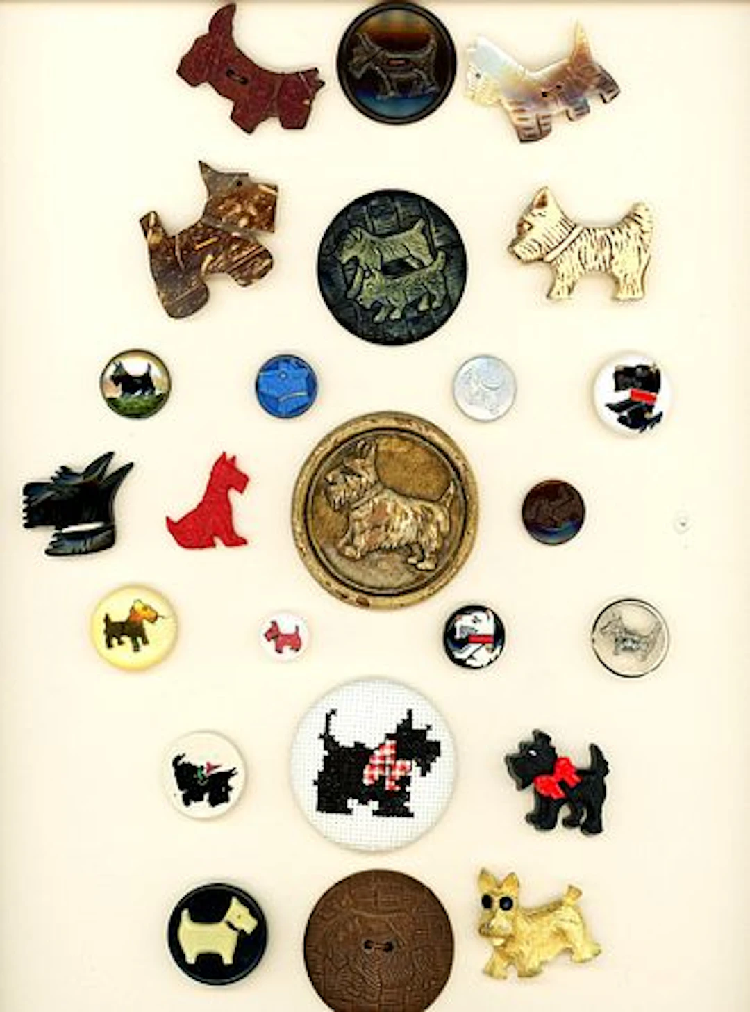 A CARD OF DIVISION THREE ASSORTED MATERIAL BUTTONS