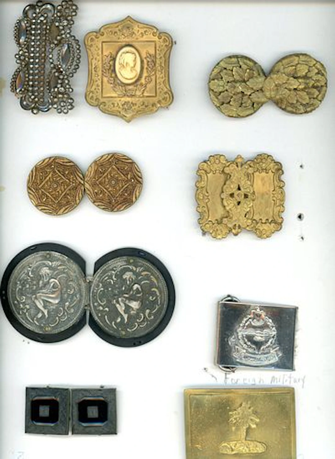 A CARD OF DIVISION ONE AND THREE BUCKLES