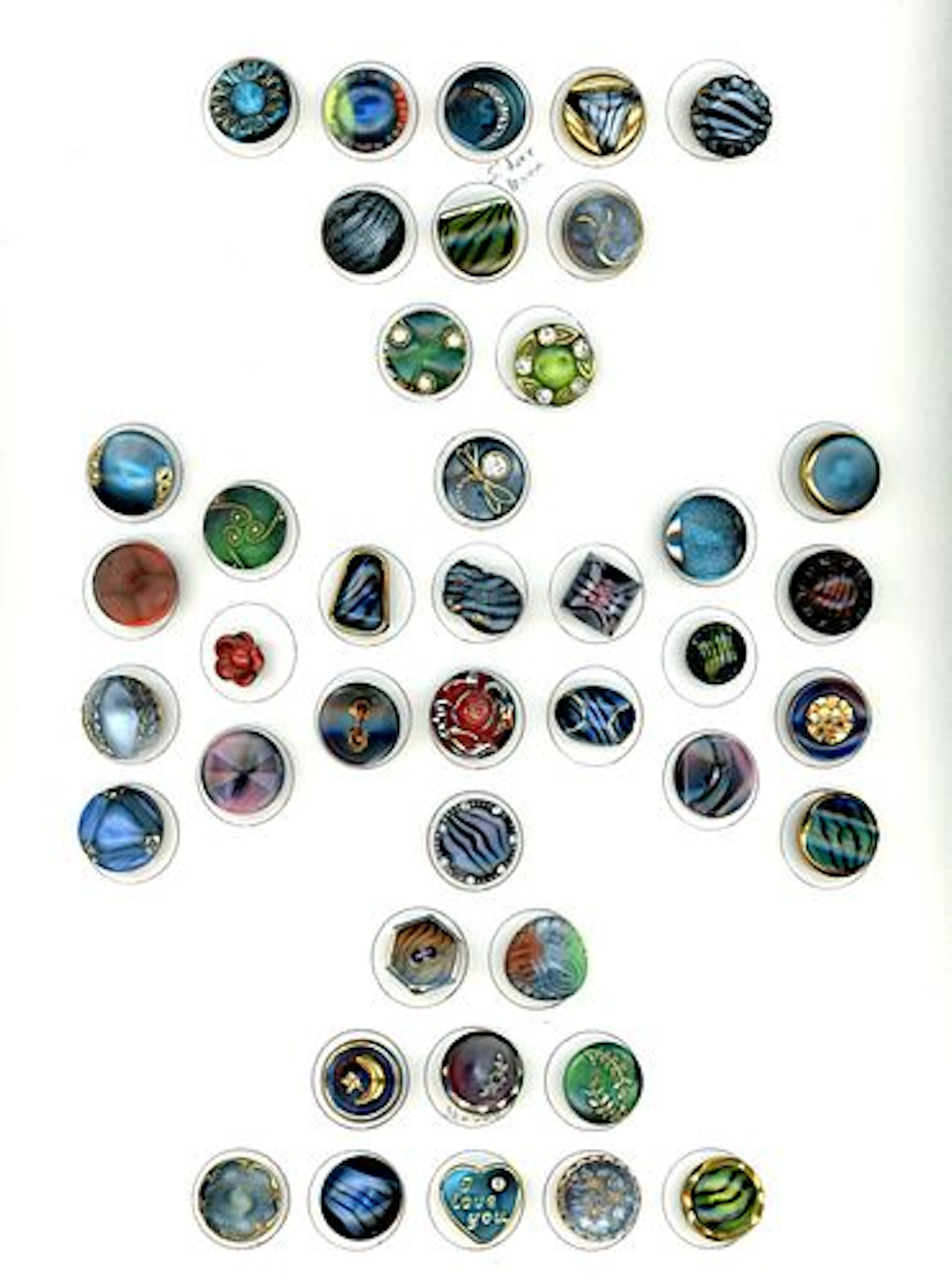 A CARD OF DIVISION THREE SPECIALIZED GLASS BUTTONS