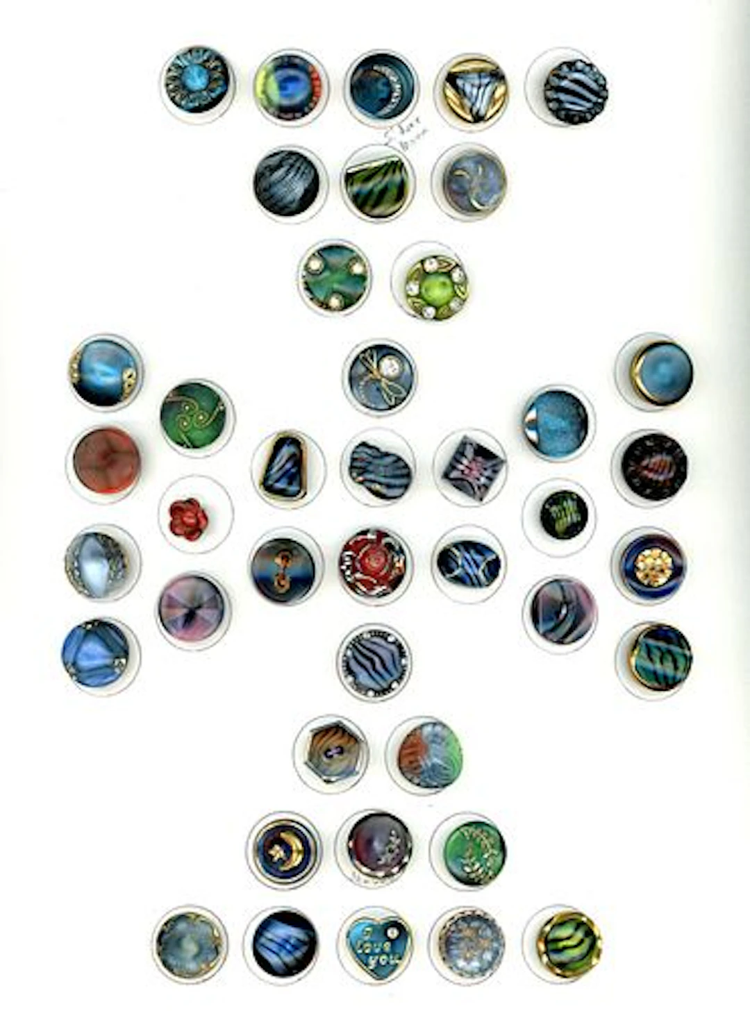 A CARD OF DIVISION THREE SPECIALIZED GLASS BUTTONS