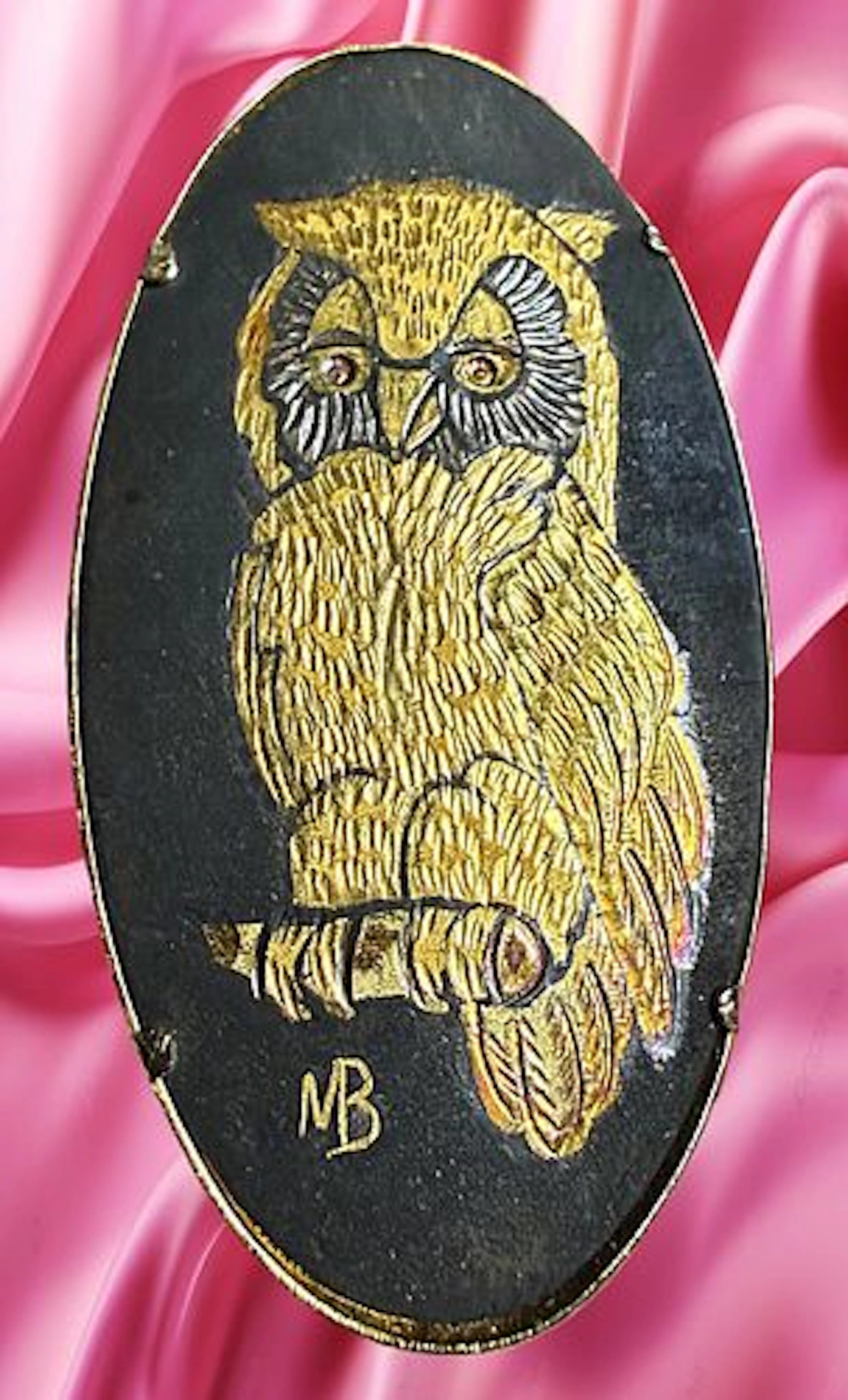 A DIVISION THREE METAL WORKS ANIMAL BUTTON
