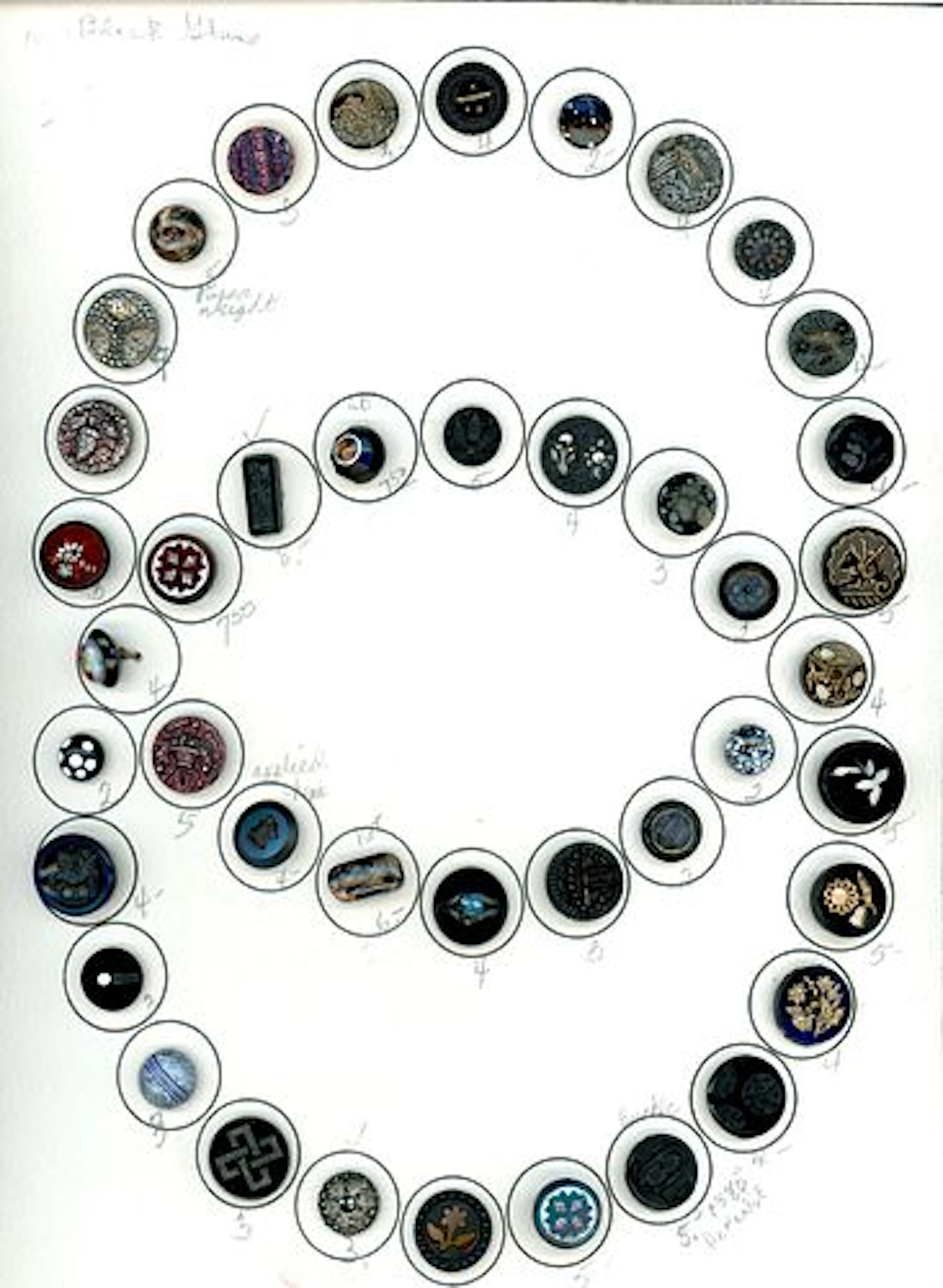 A CARD OF DIVISION ONE ASSORTED BLACK GLASS BUTTONS