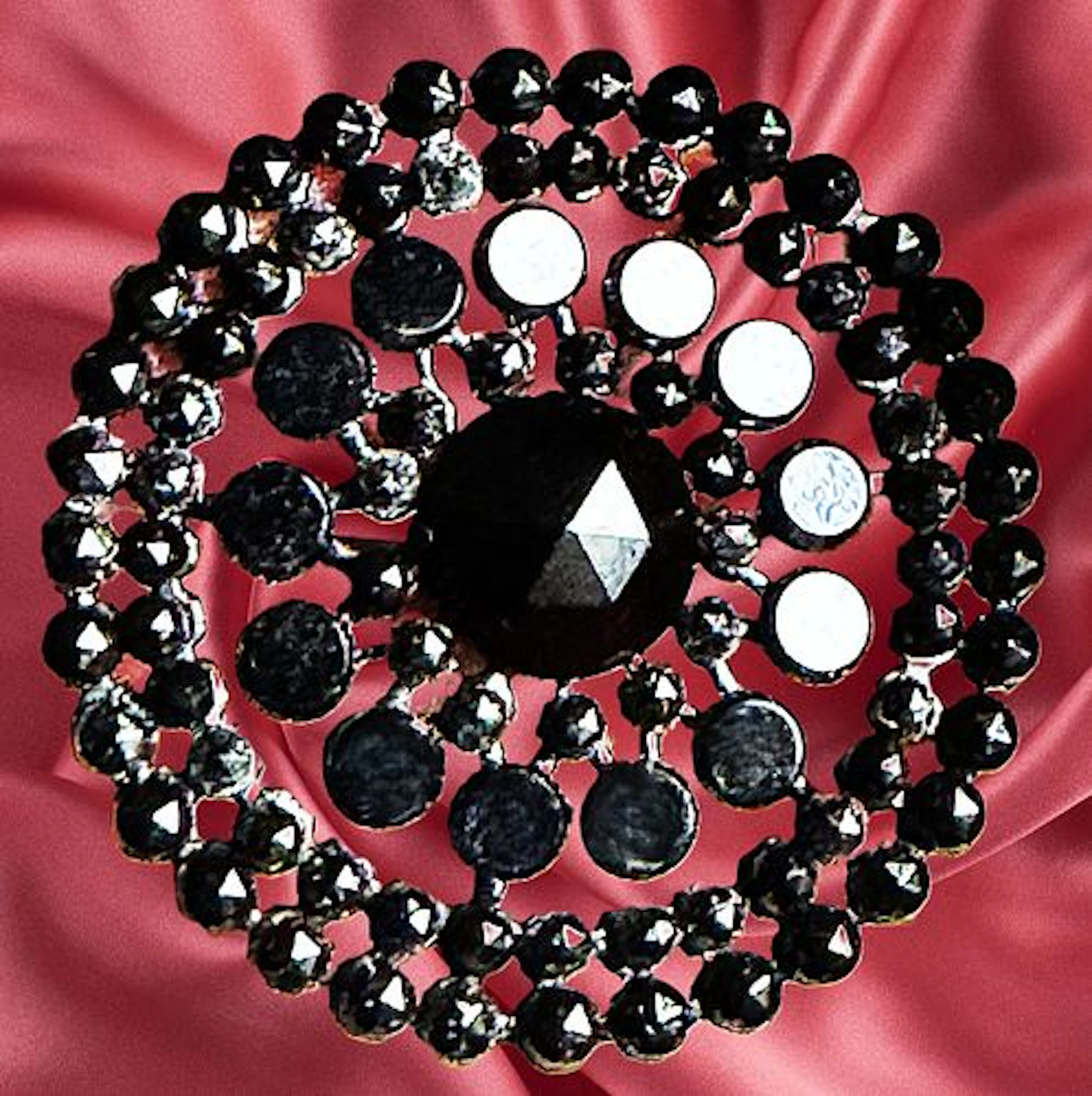 A DIVISION ONE PIERCED RIVETED BLACK GLASS BUTTON