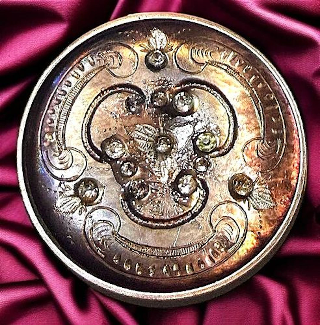 A DIVISION ONE ENGRAVED PEARL AND PASTE BUTTON