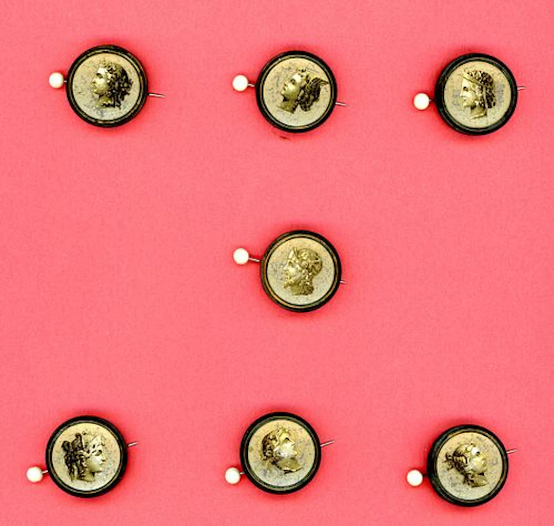 A CARD OF DIVISION ONE HEAD PROFILE BUTTONS