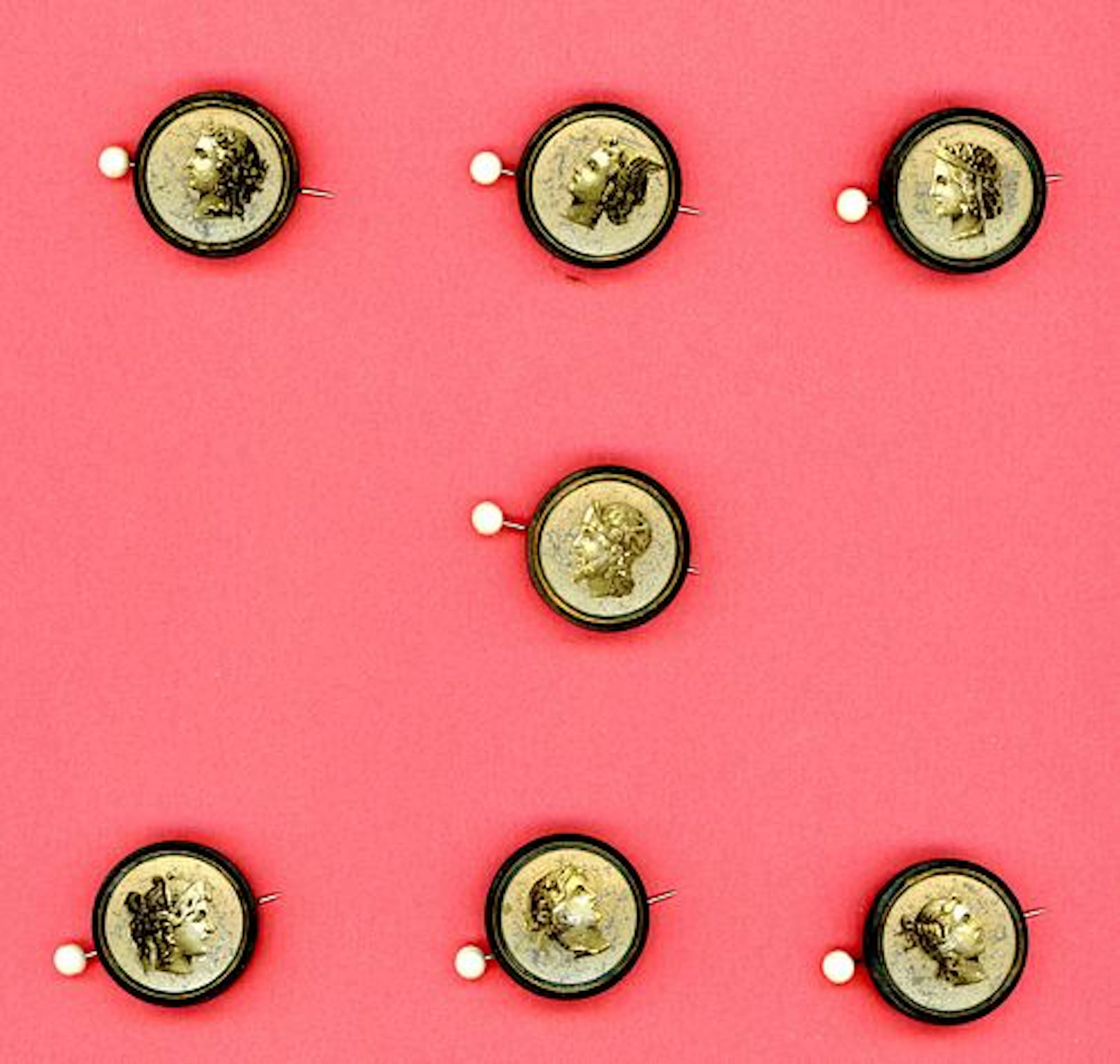 A CARD OF DIVISION ONE HEAD PROFILE BUTTONS