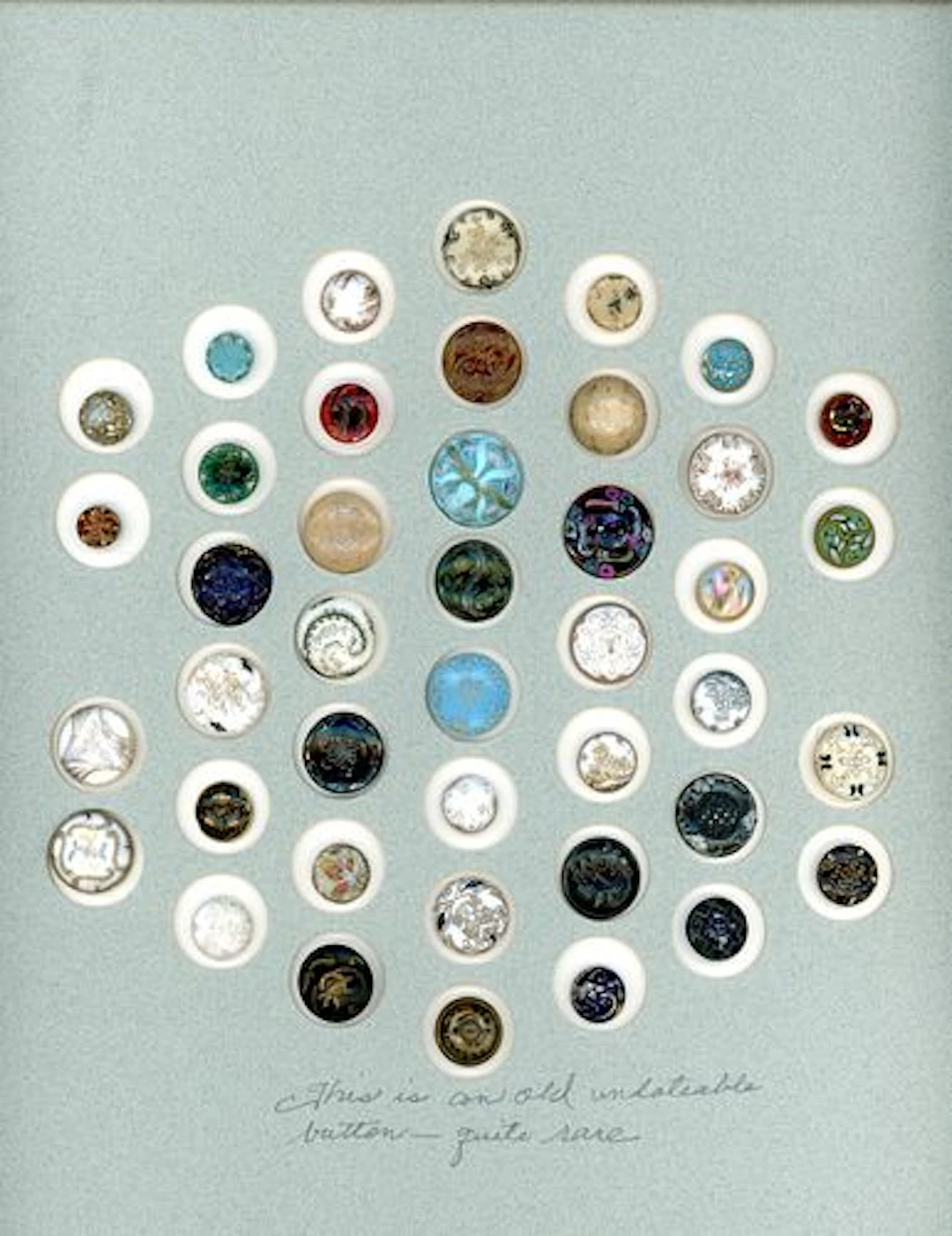 A CARD OF DIVISION ONE VICTORIAN GLASS BUTTONS