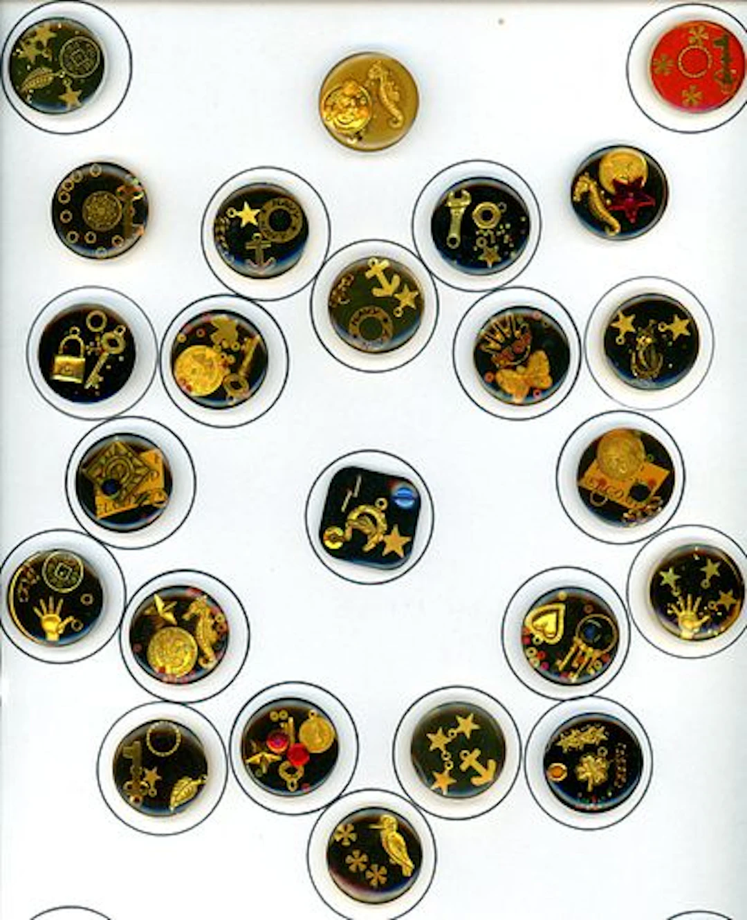 A CARD OF DIVISION THREE "JUNQUE" BUTTONS
