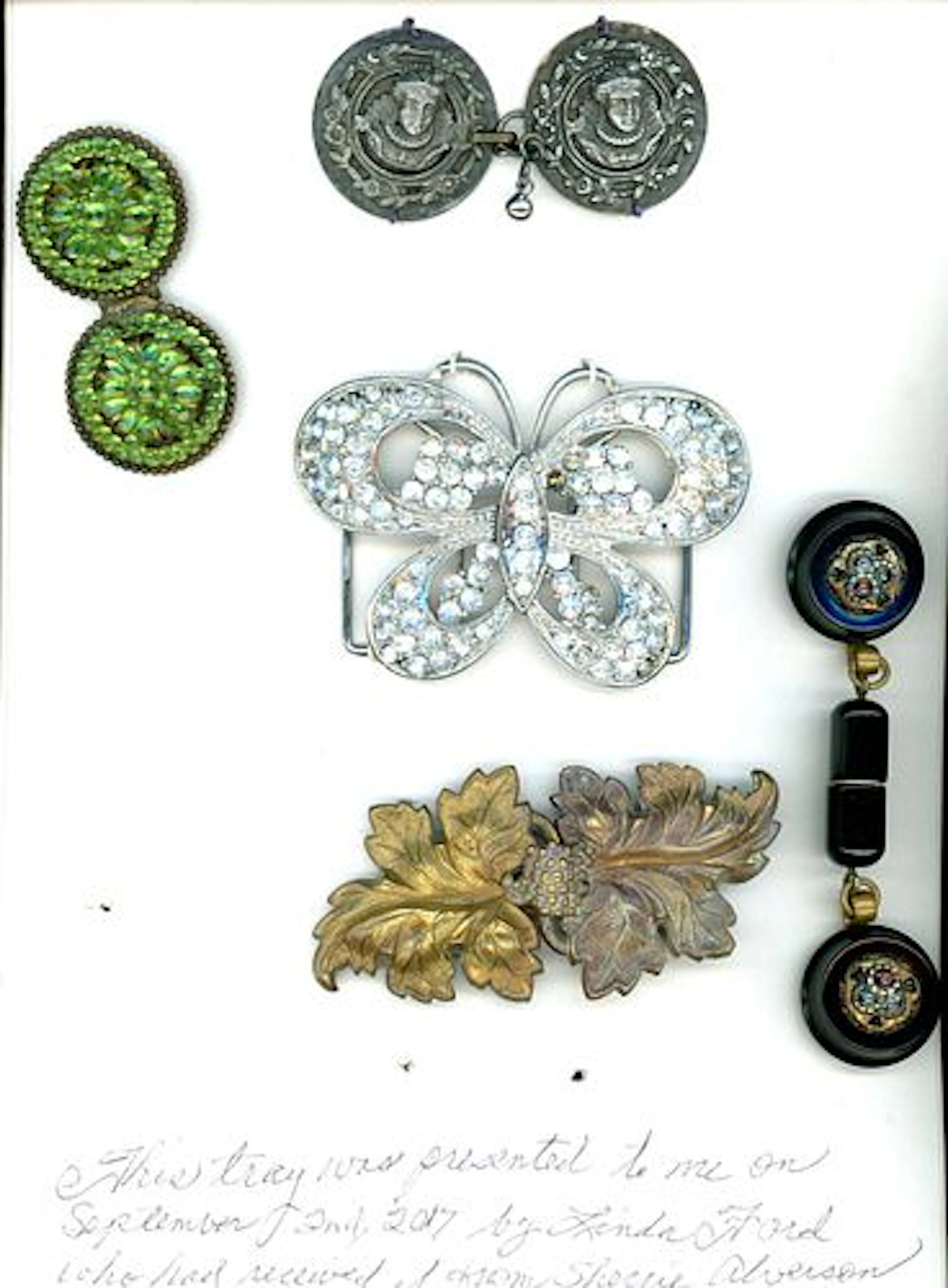 A CARD OF DIVISION ONE AND THREE BUCKLES