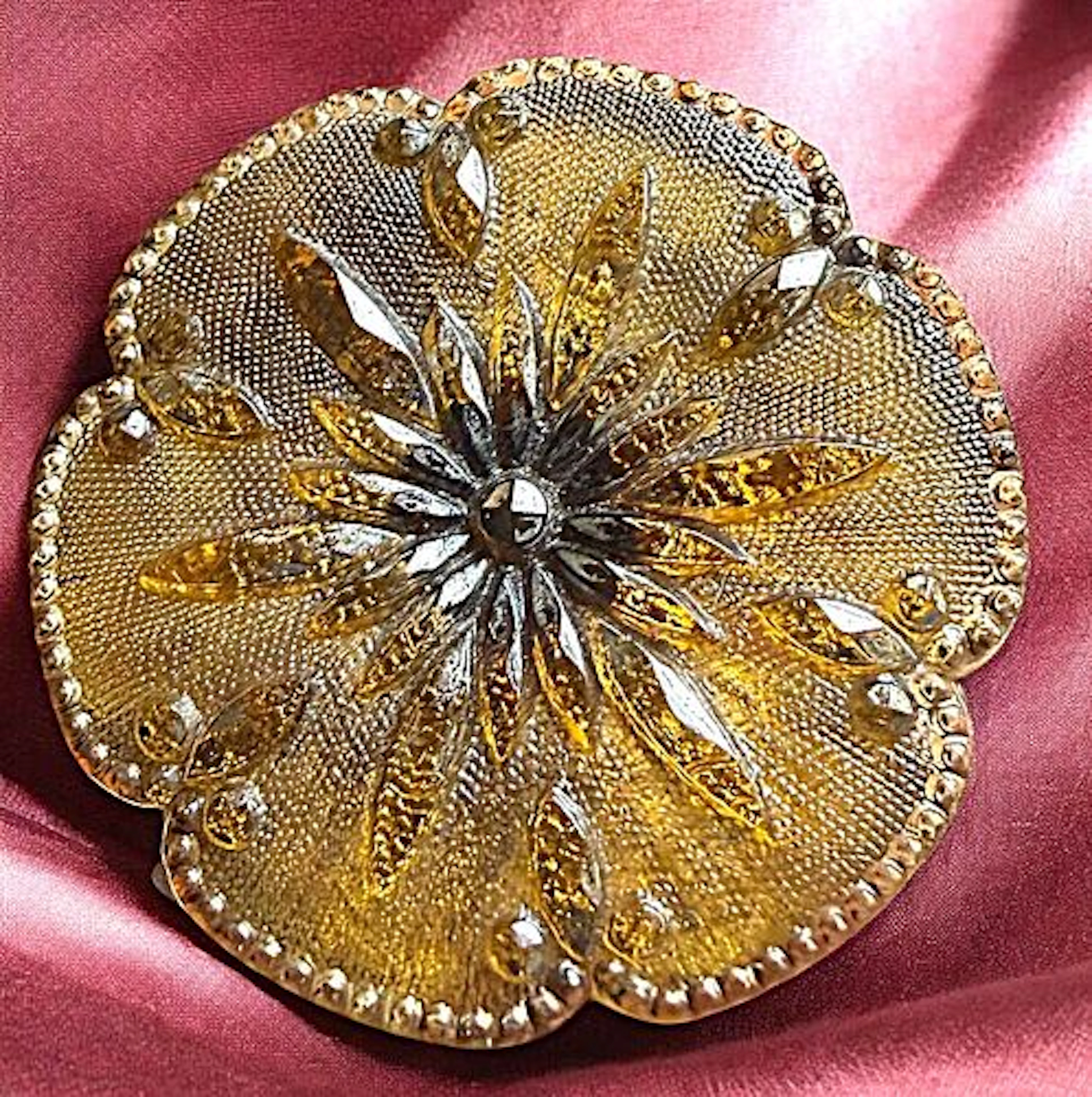 A DIVISION ONE SHAPED LACY GLASS BUTTON