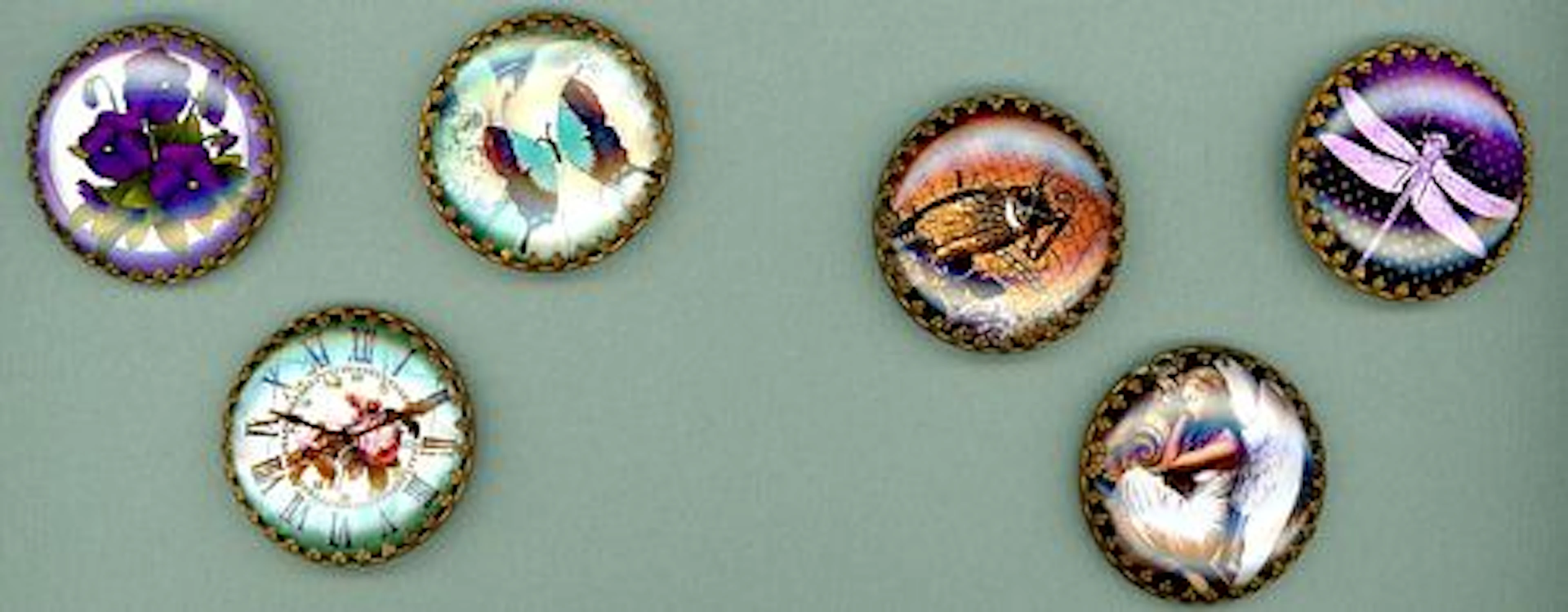 A SMALL CARD OF DIVISION THREE GLASS IN METAL BUTTONS