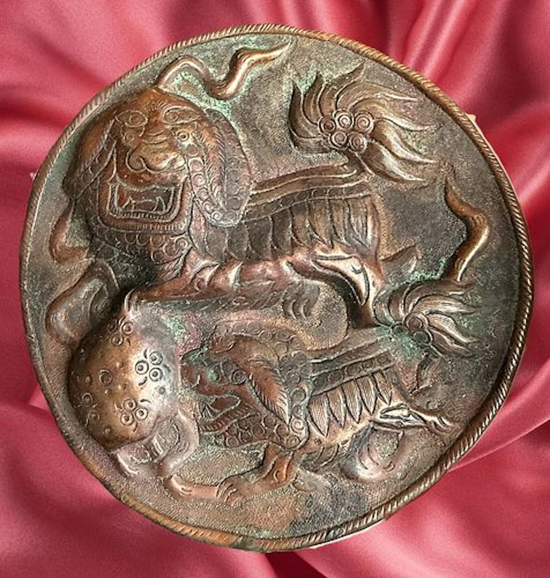 A DIVISION ONE REPOUSSE COPPER BUTTON