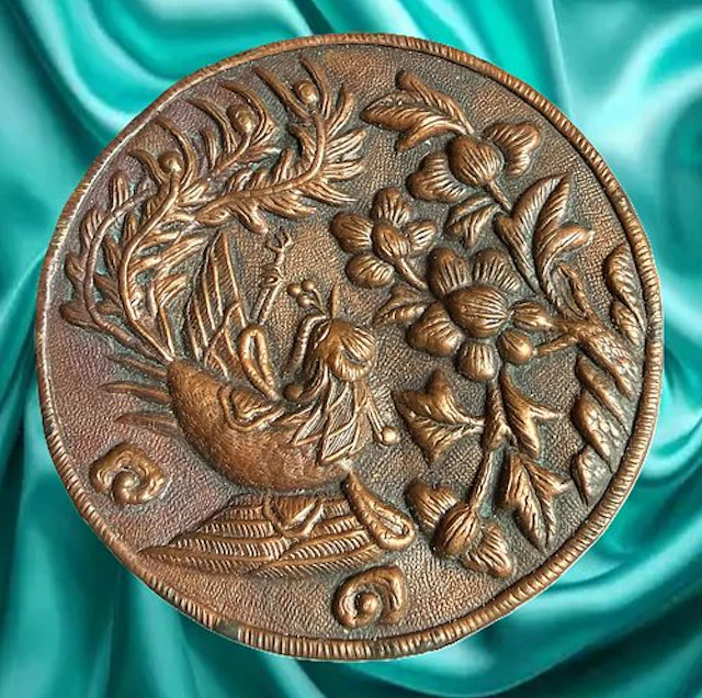 A DIVISION ONE REPOUSSE COPPER BUTTON