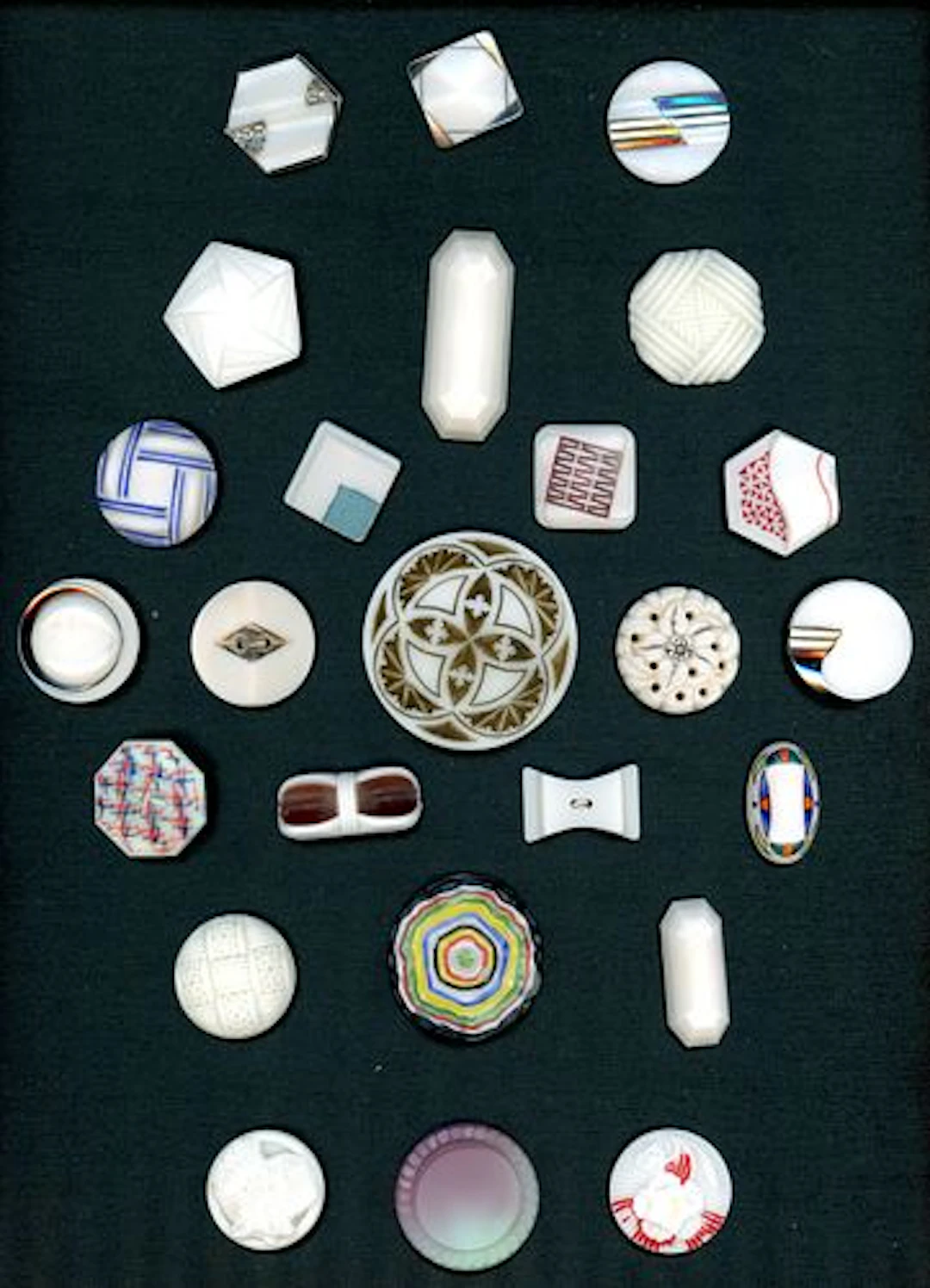 A CARD OF DIVISION THREE ASSORTED GLASS BUTTONS