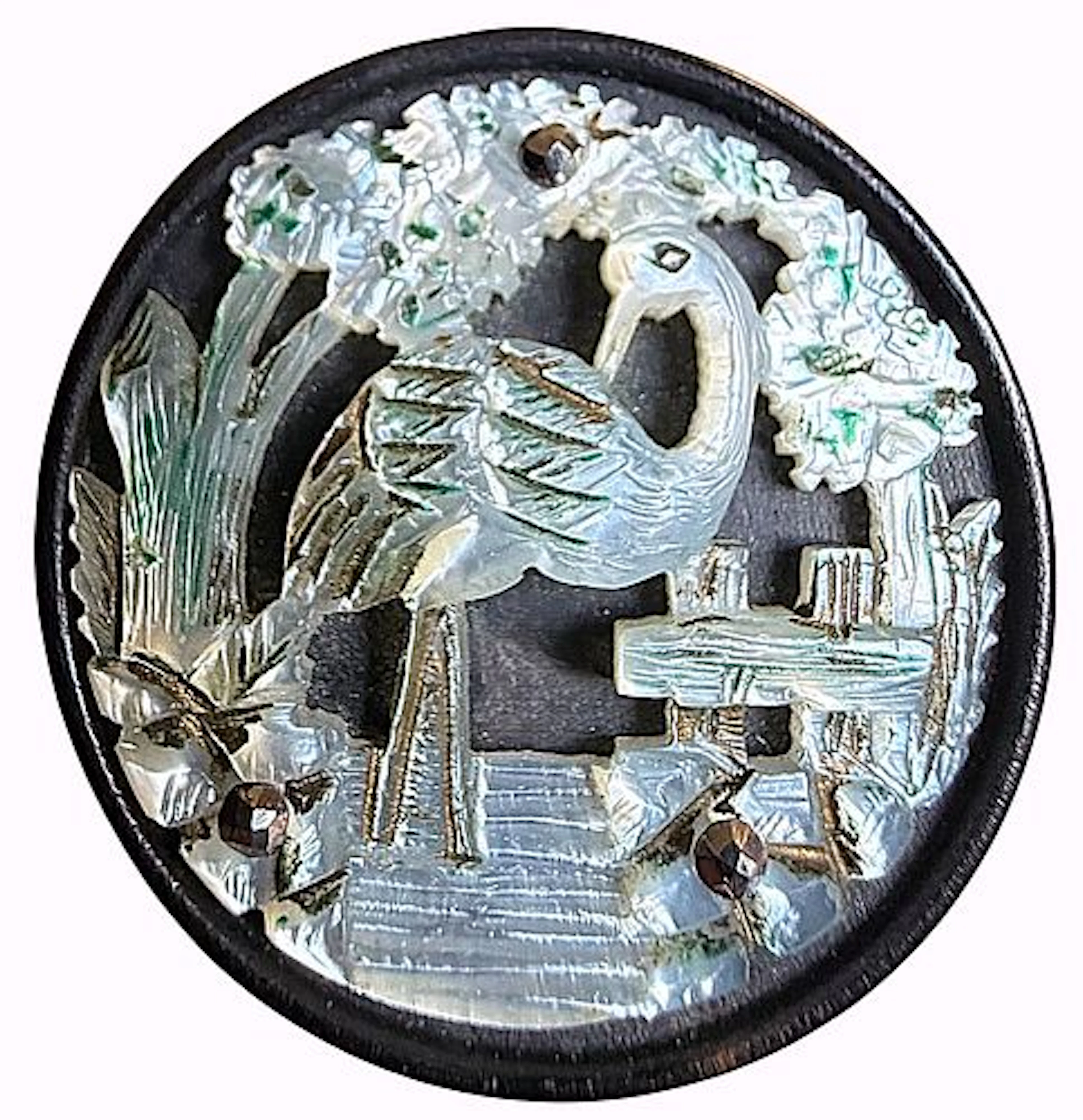 A DIVISION ONE CARVED PEARL AND WOOD BUTTON