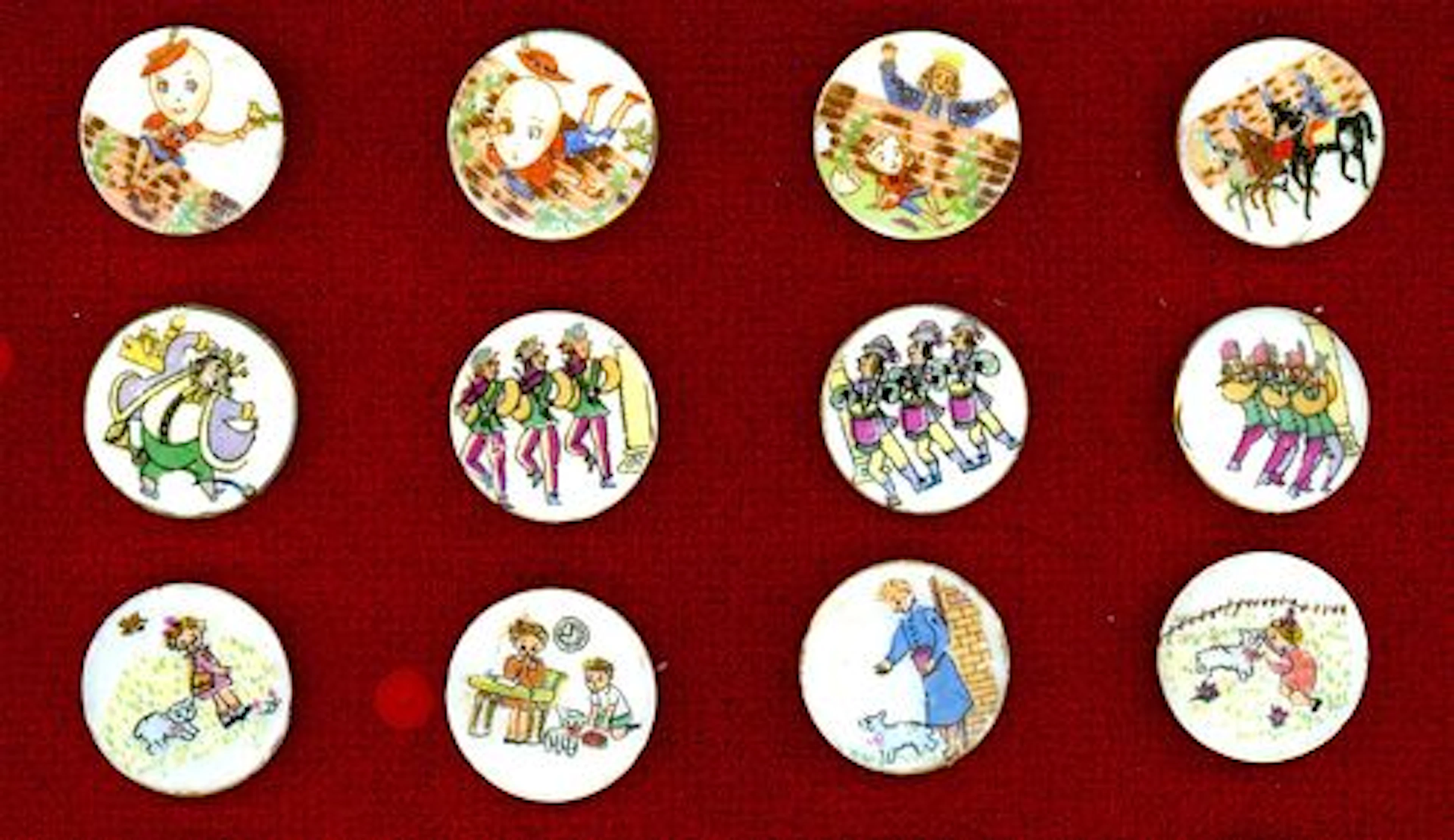 A SMALL CARD OF DIVISION THREE NURSERY RHYME BUTTONS